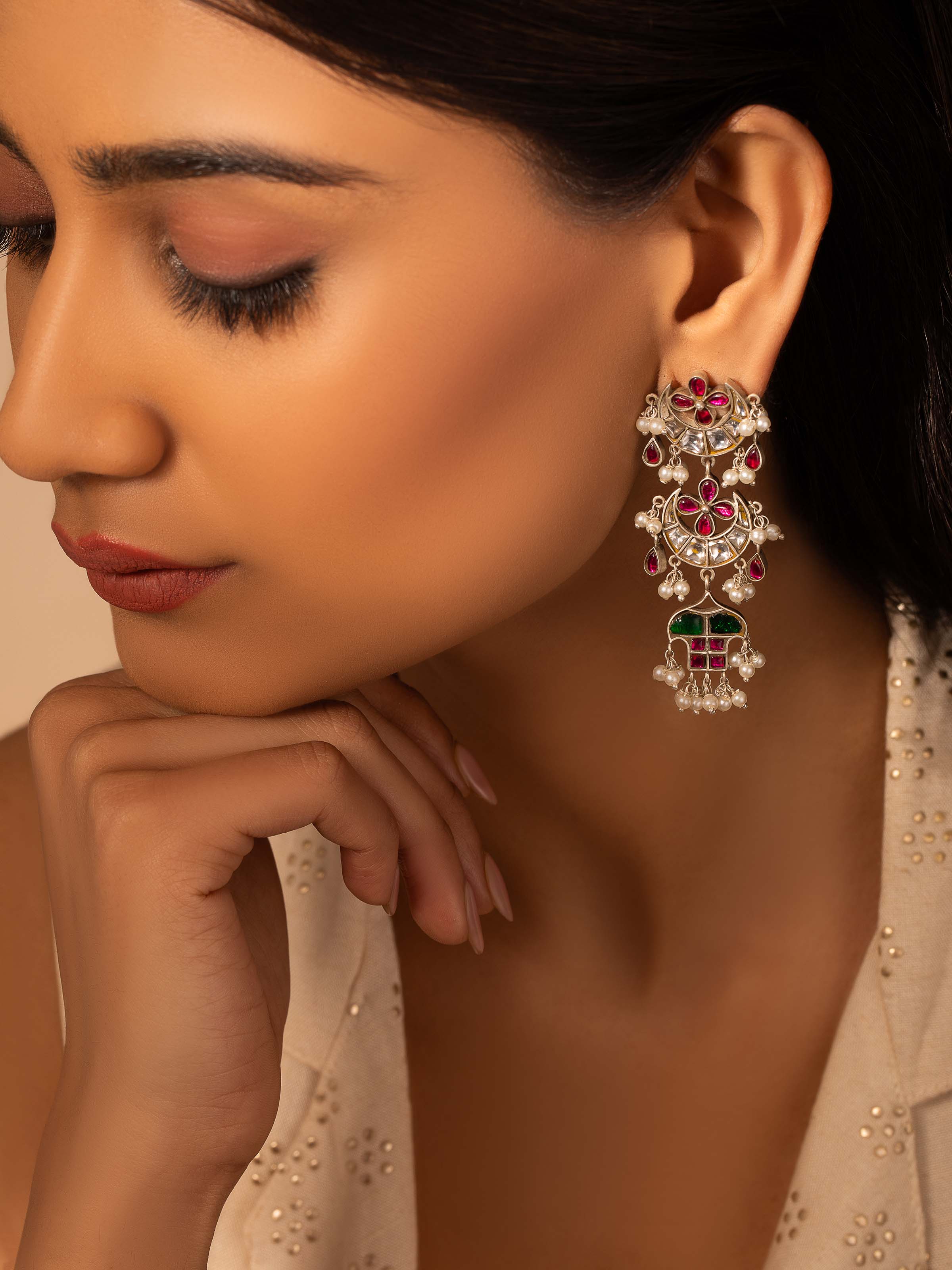 Close-up view of Silver Smithing Drop Earrings highlighting detailed silver craftsmanship.