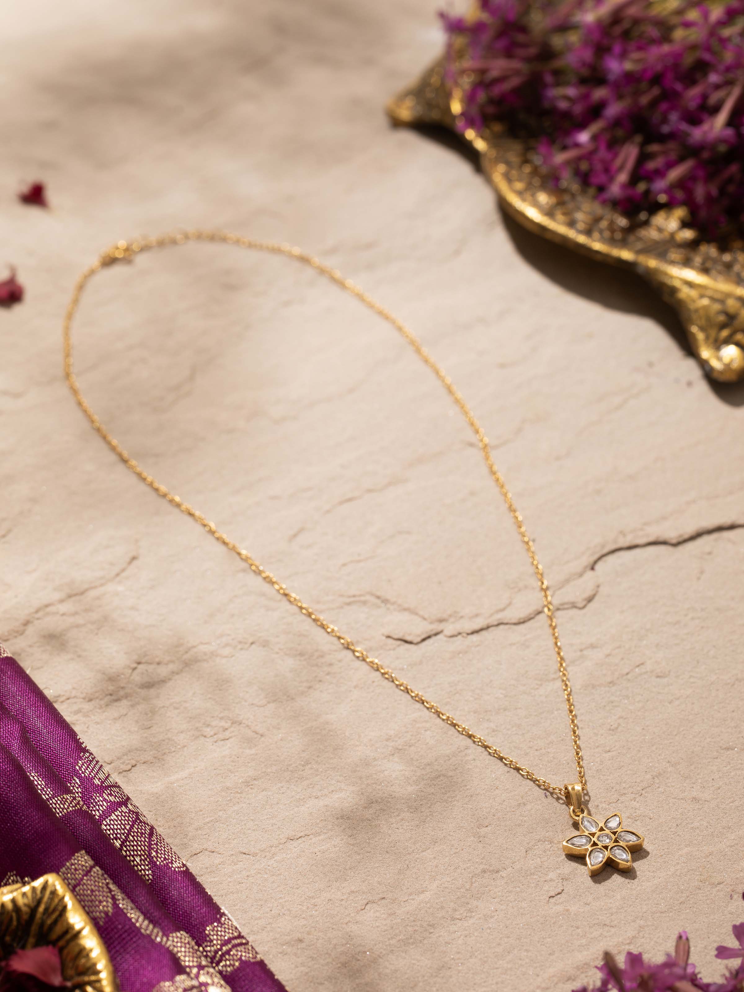 Side view of Silver Smithing Pendant & Chain showcasing the pendant's intricate detail and the chain's length