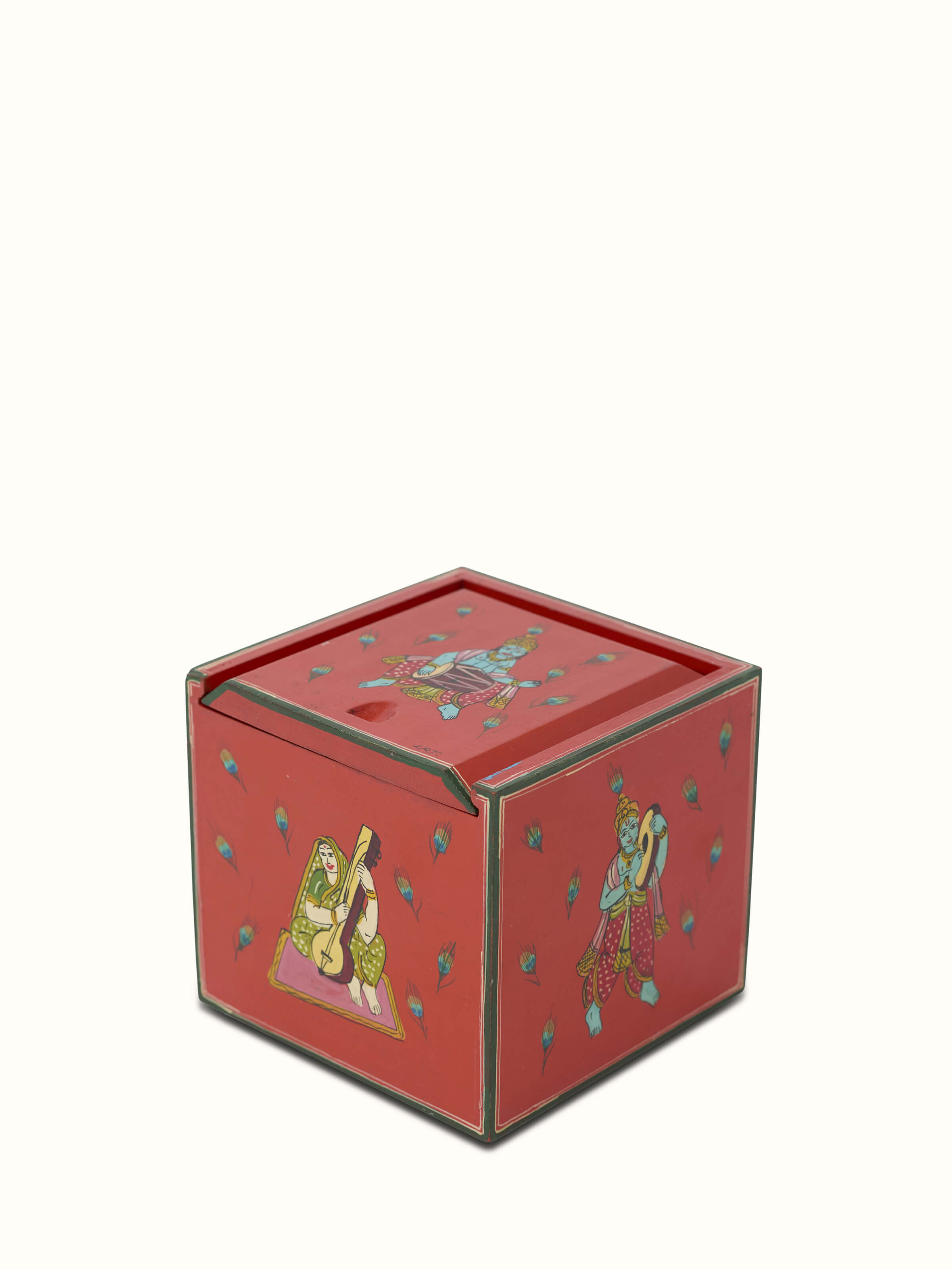 Side view of Ganjifa paper cards in red, displaying intricate traditional patterns and card set arrangement, Swadesh