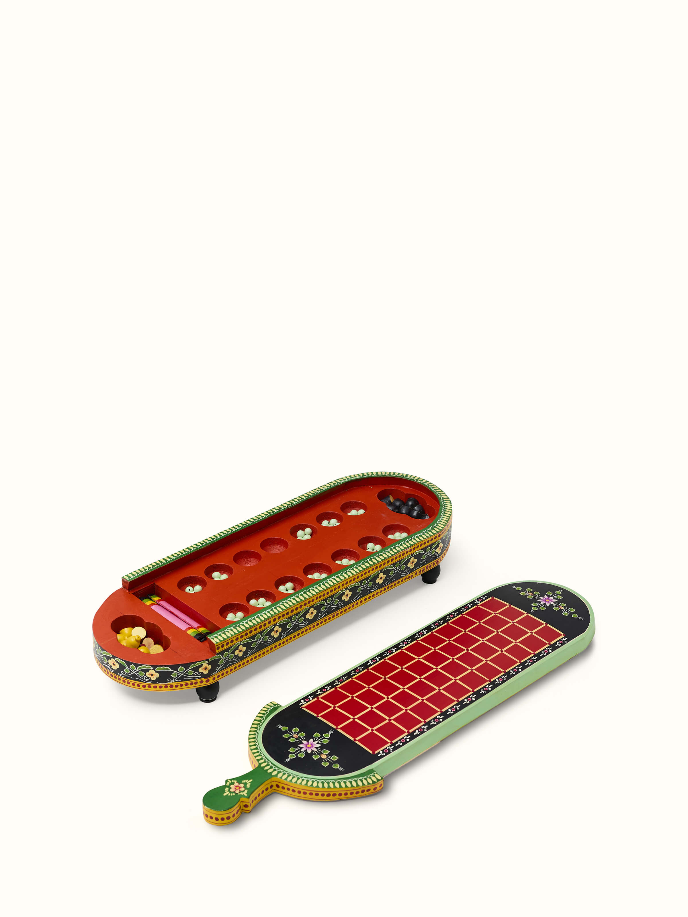 Close-up of Ganjifa cedar wood 6-in-1 board game in red focusing on its high-quality material