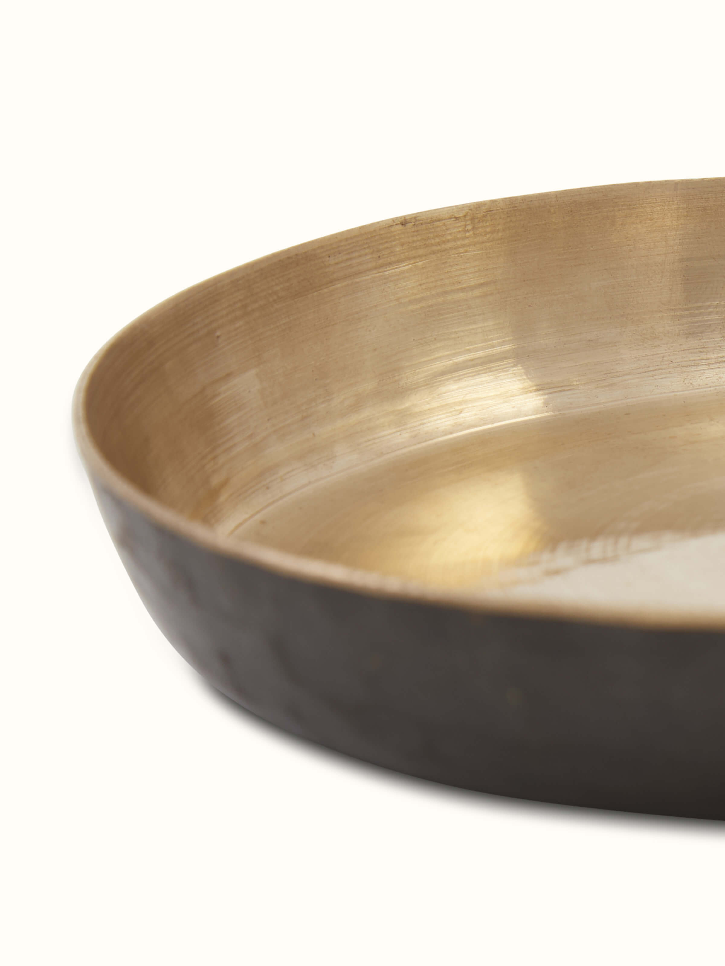 Close-up view of bell metal salad plate, showcasing the detailed pattern and finish