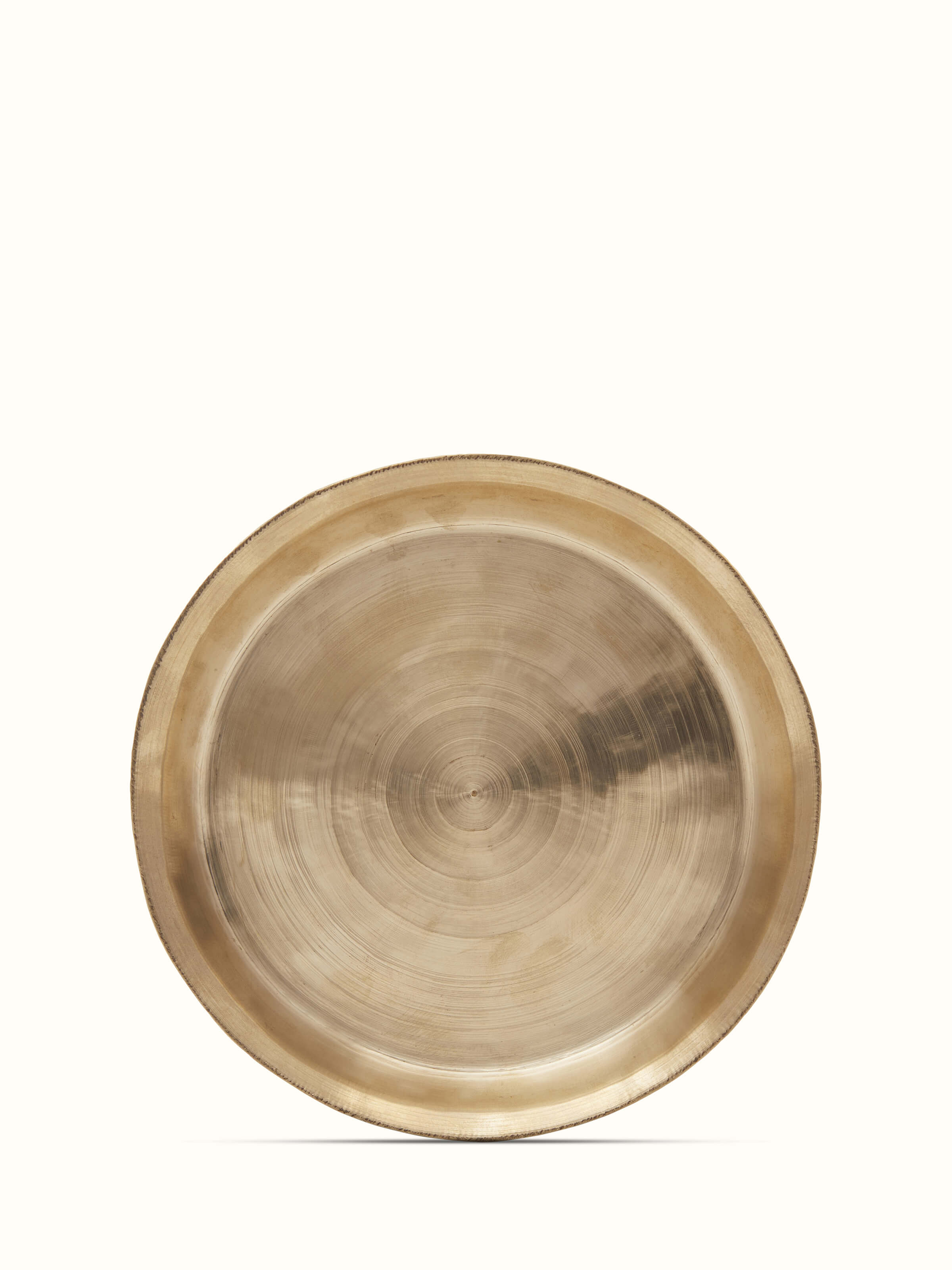 Front view of bell metal Balisiri side plate, featuring a polished metal finish and traditional design