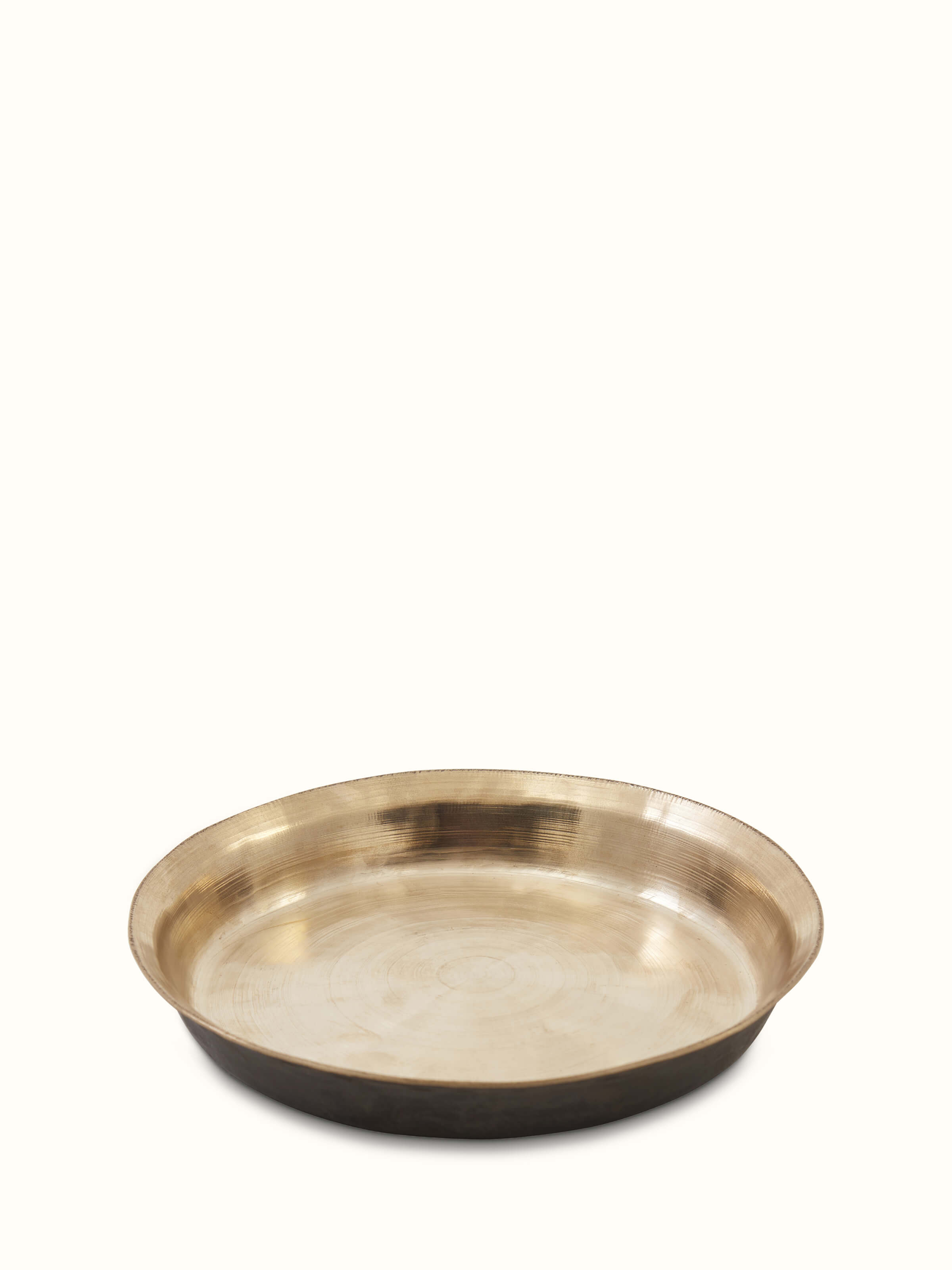 Top view of bell metal Balisiri side plate, showcasing the detailed craftsmanship and metal texture