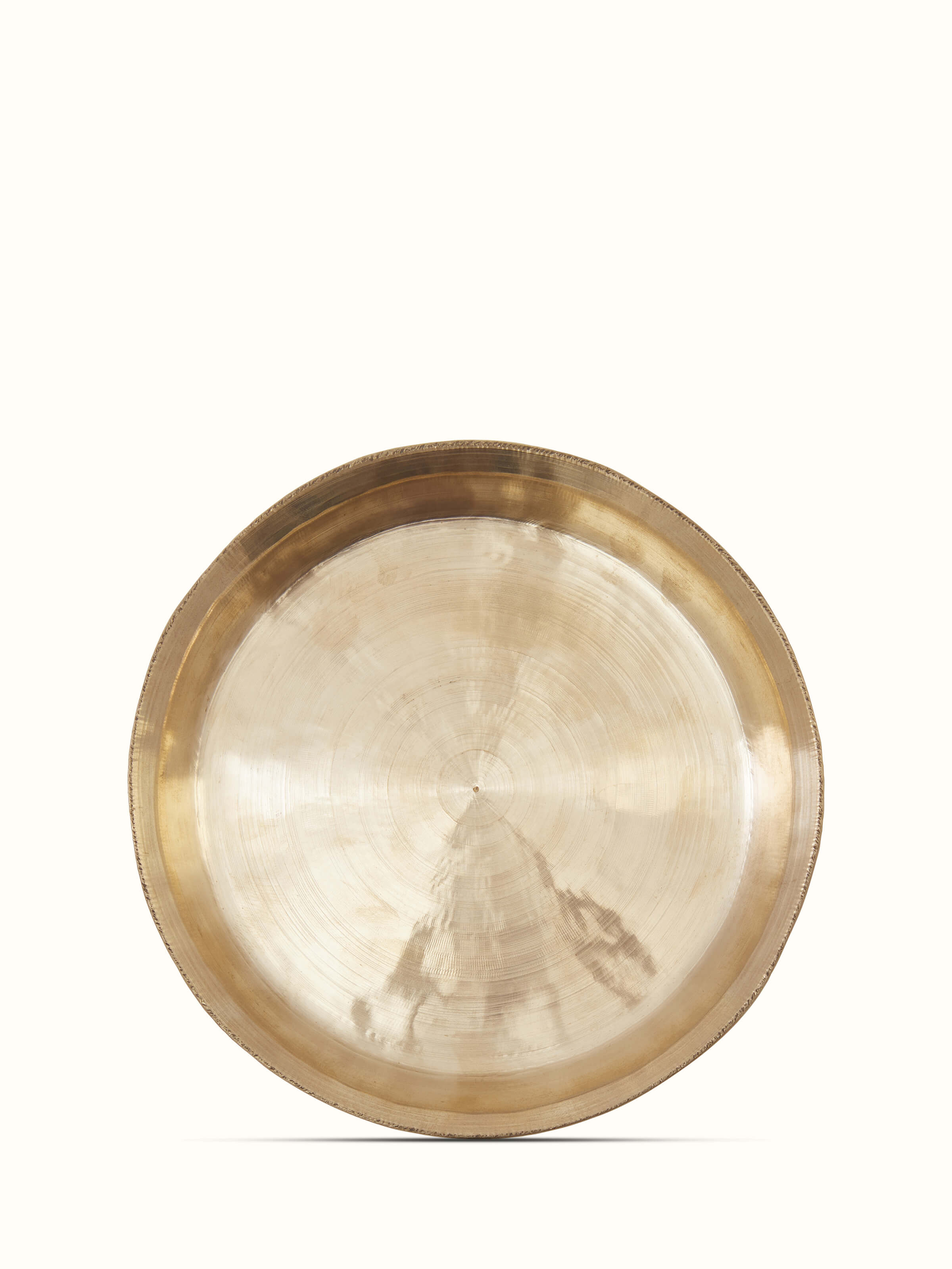 Close-up of bell metal Balisiri side plate, highlighting the intricate patterns and quality of the metalwork