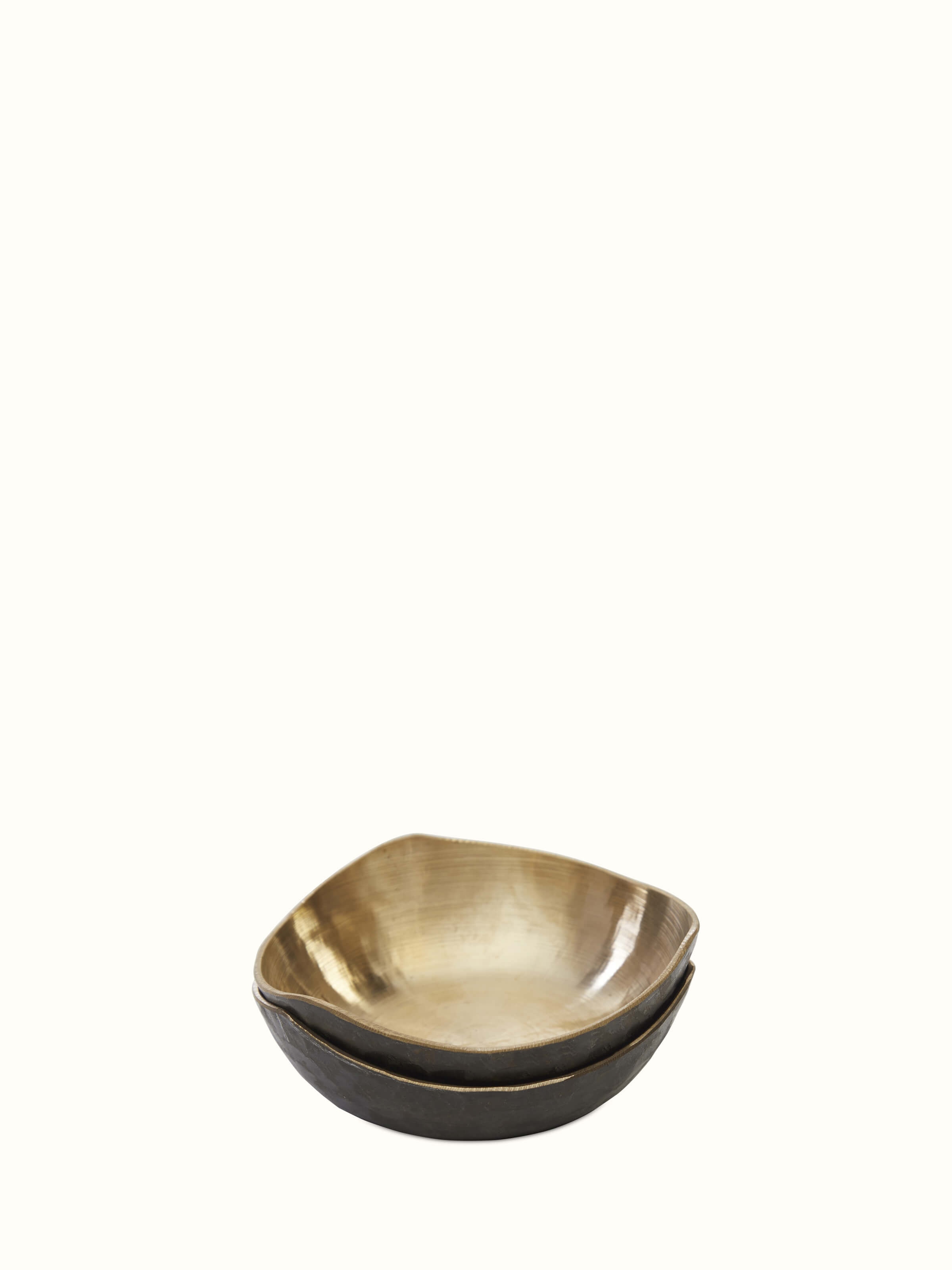 Side view of Bell metal triangular dinner bowl showcasing its sleek, reflective surface and modern design