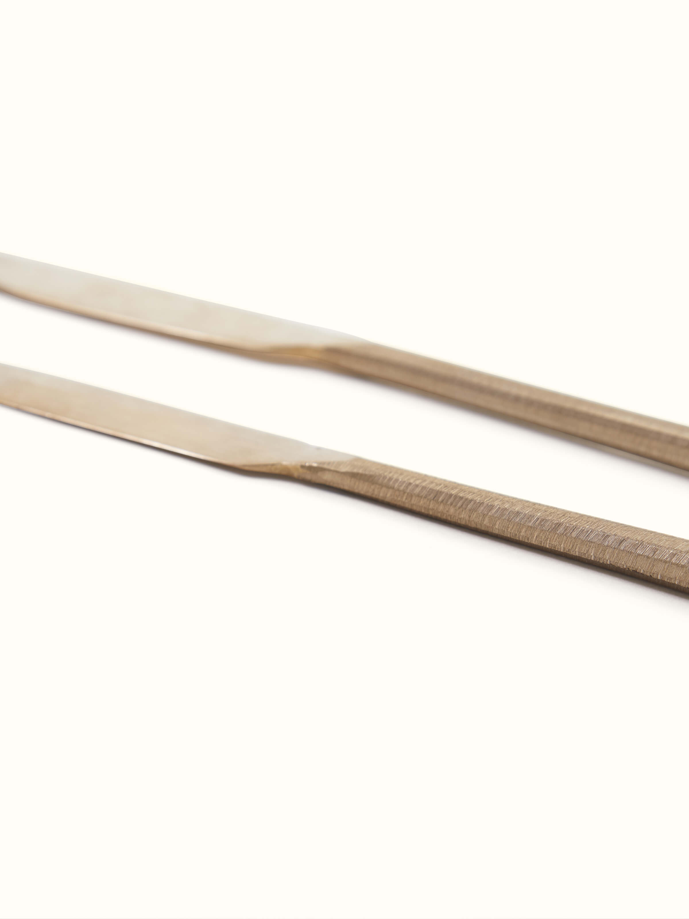 Side view of bell metal dinner knife featuring detailed engravings