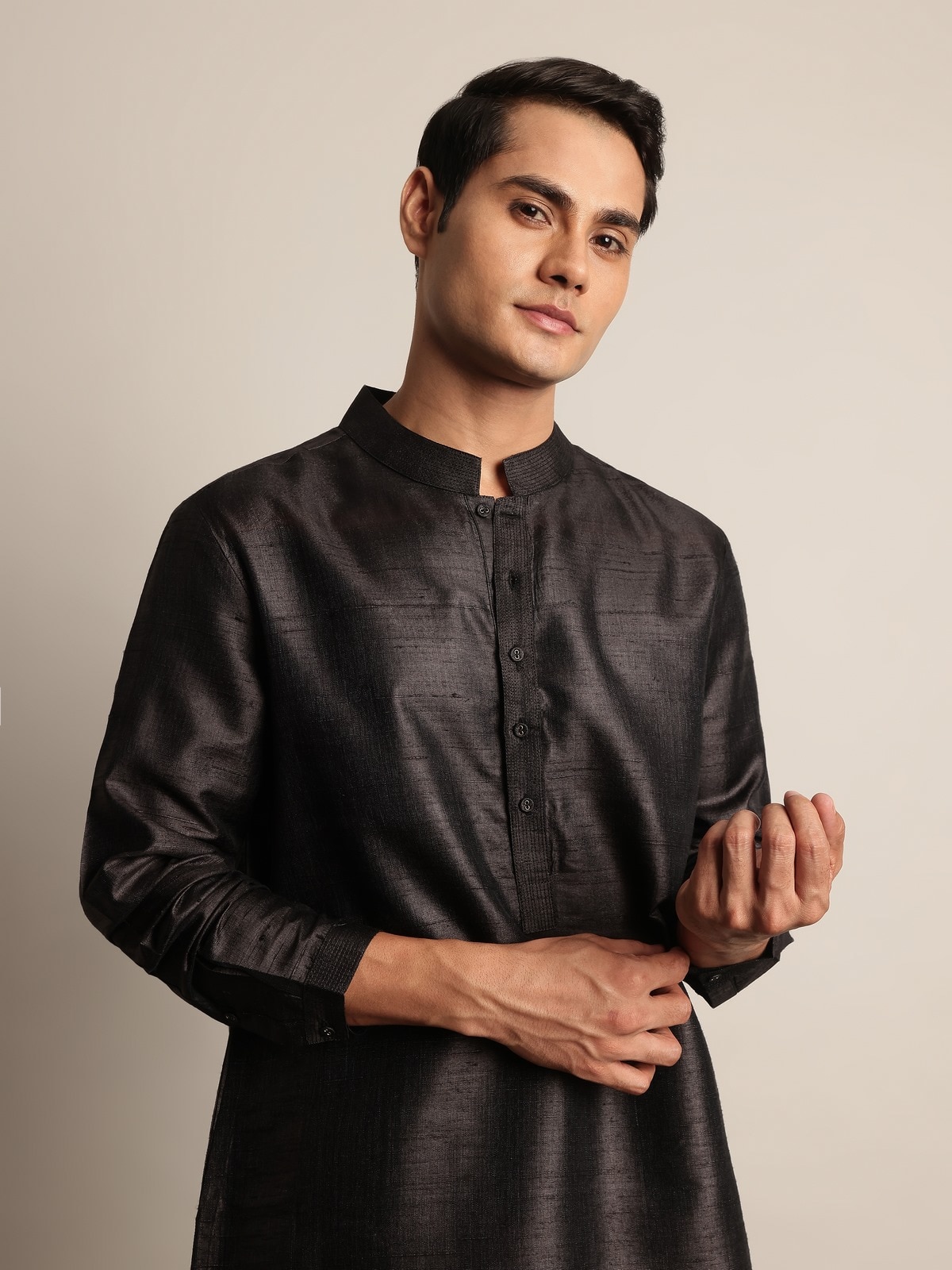 Side angle showcasing the kurta’s easy silhouette and sheen.