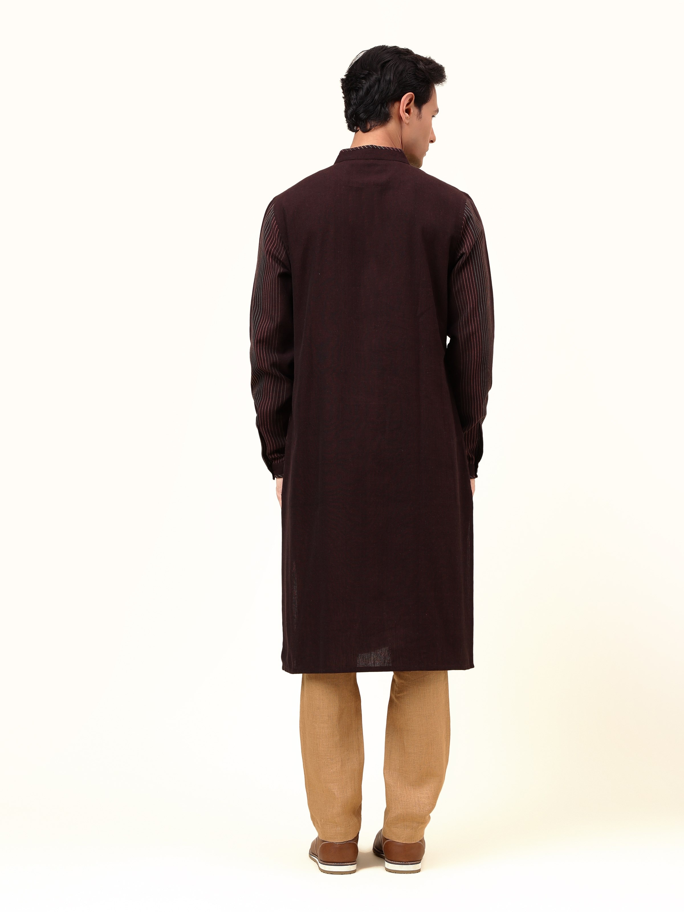 Back view revealing the uniform stripes and natural textures, a versatile addition to any conscious wardrobe.