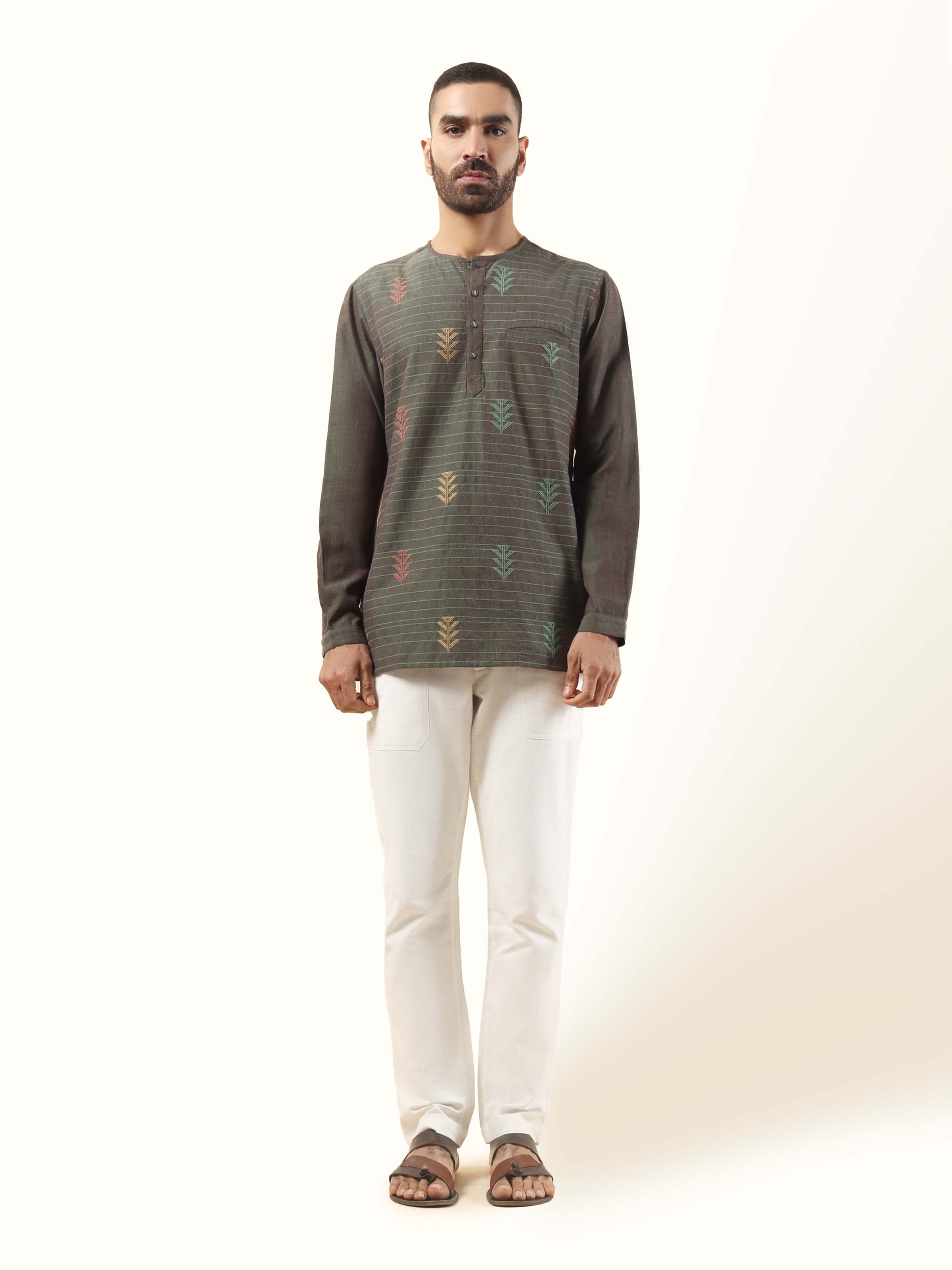 Front view of brown cotton extra-weft short kurta with traditional weaving and straight cut.