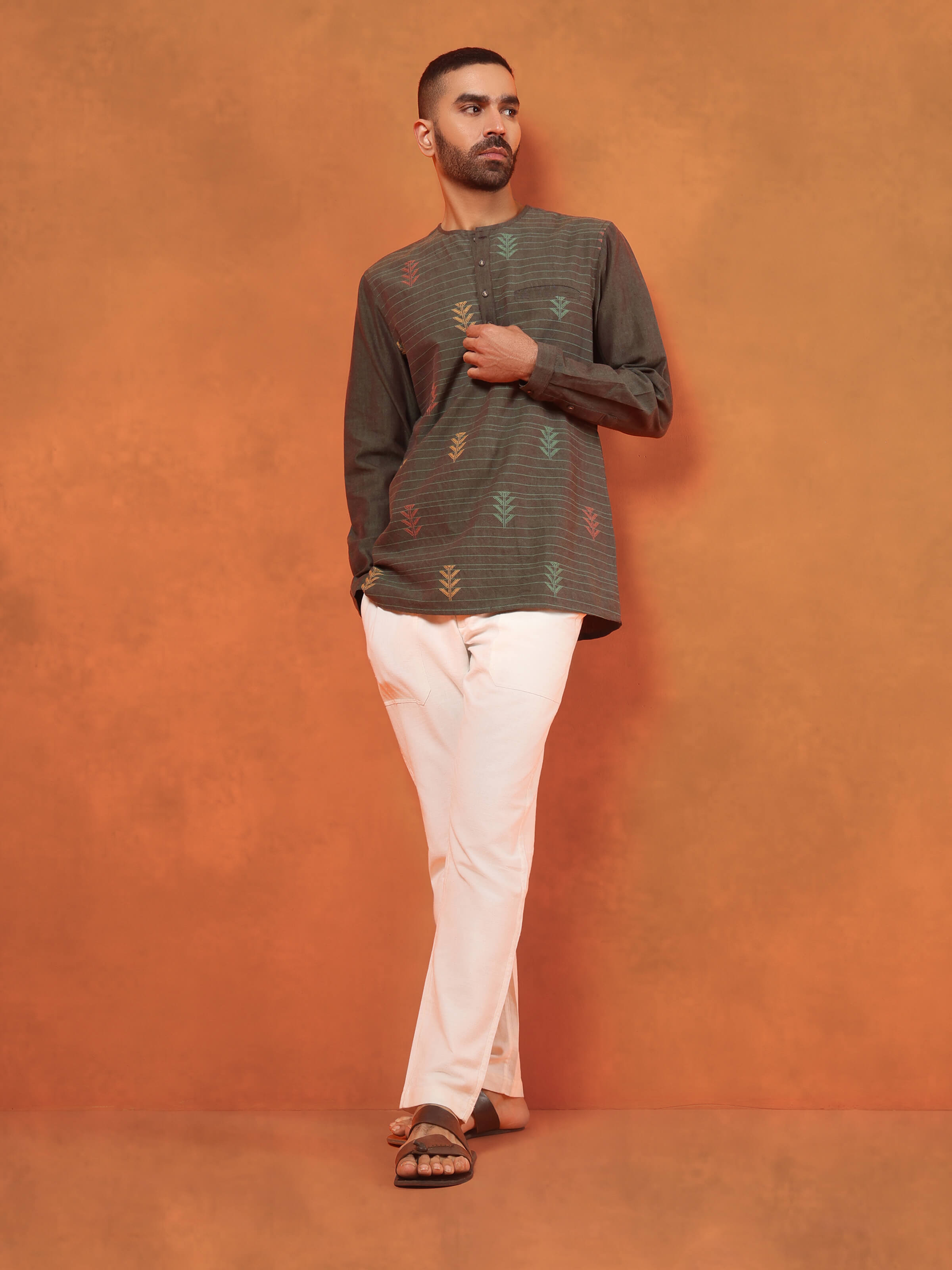 Lifestyle image of brown short kurta styled casually, showcasing everyday ethnic wear.