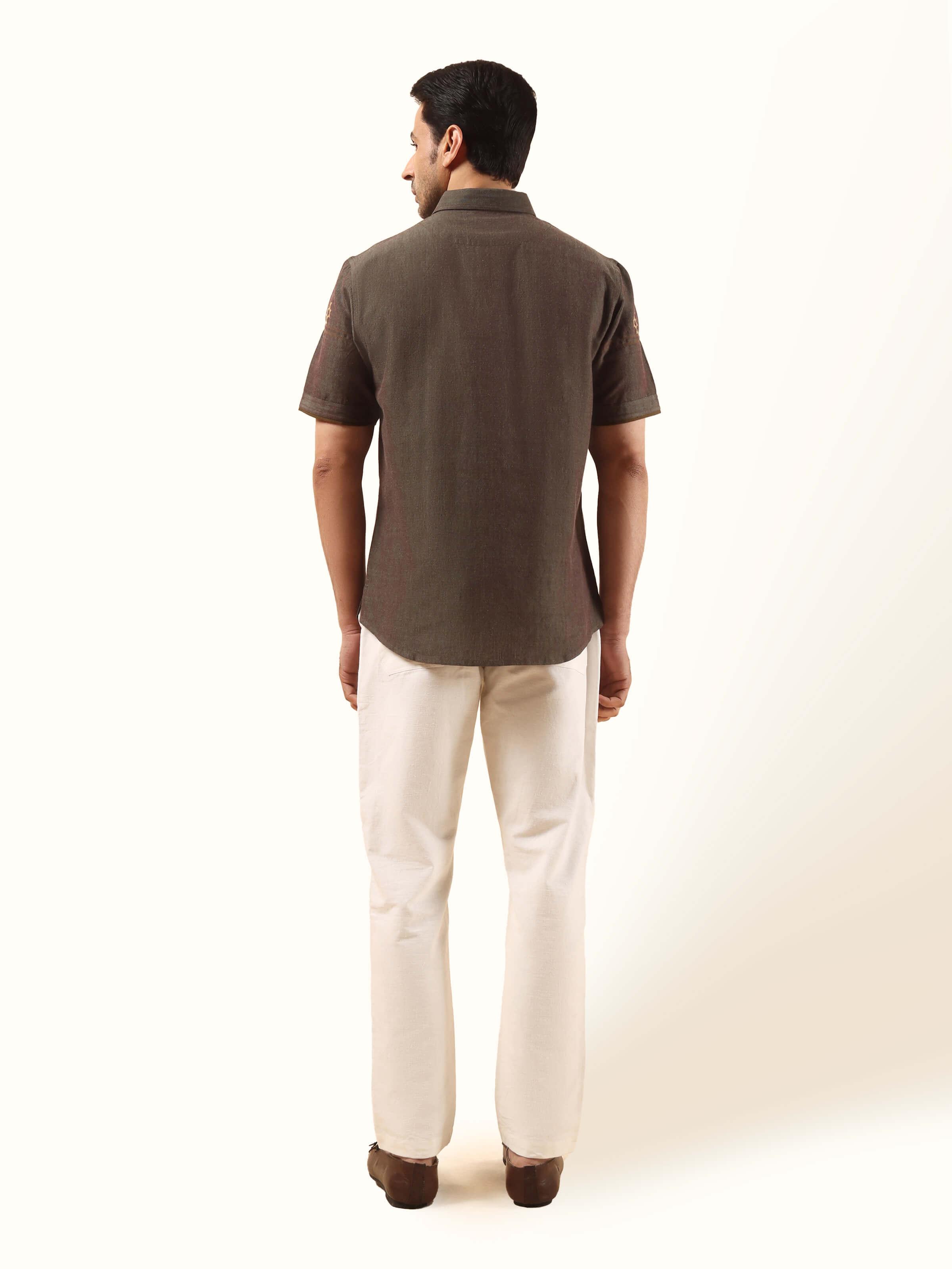 Back view of brown extra-weft shirt showcasing straight hem and shoulder detailing.