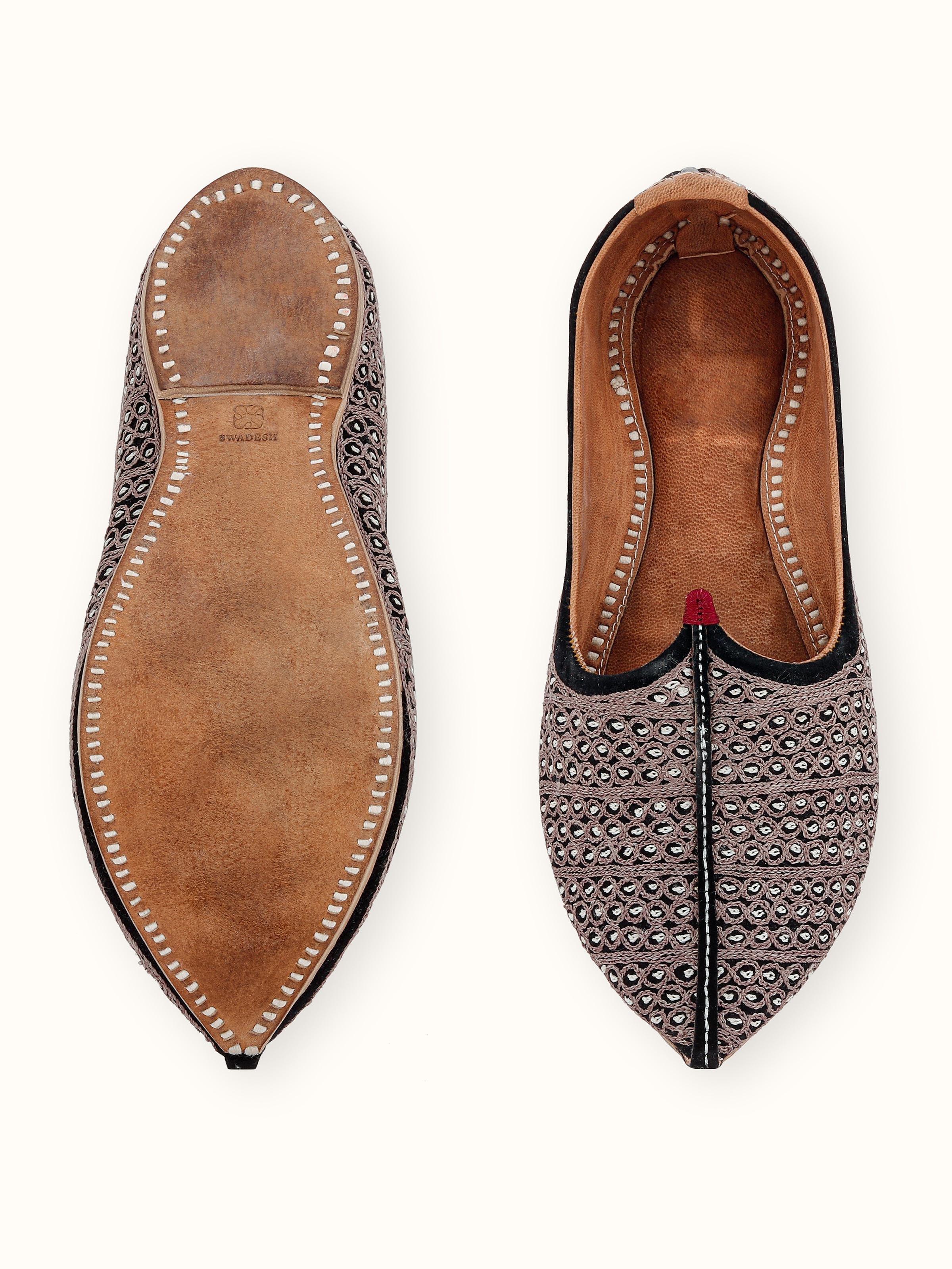 Detailed view of tan leather embroidered Jodhpuri pagrakha with emphasis on the embroidery work