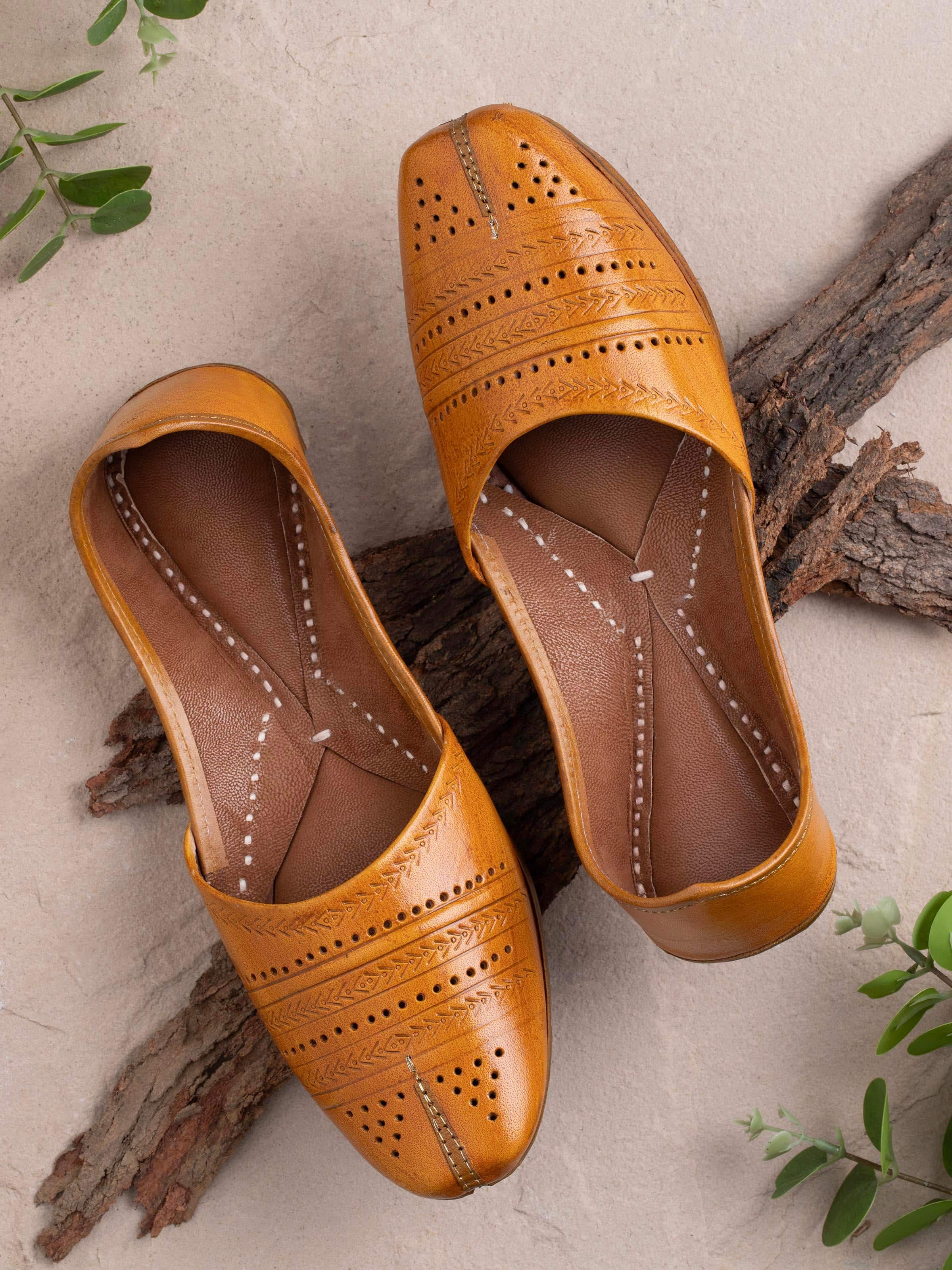 Side view of Tan Leather Haryana Punjabi Juttis focusing on the detailing and stitching.