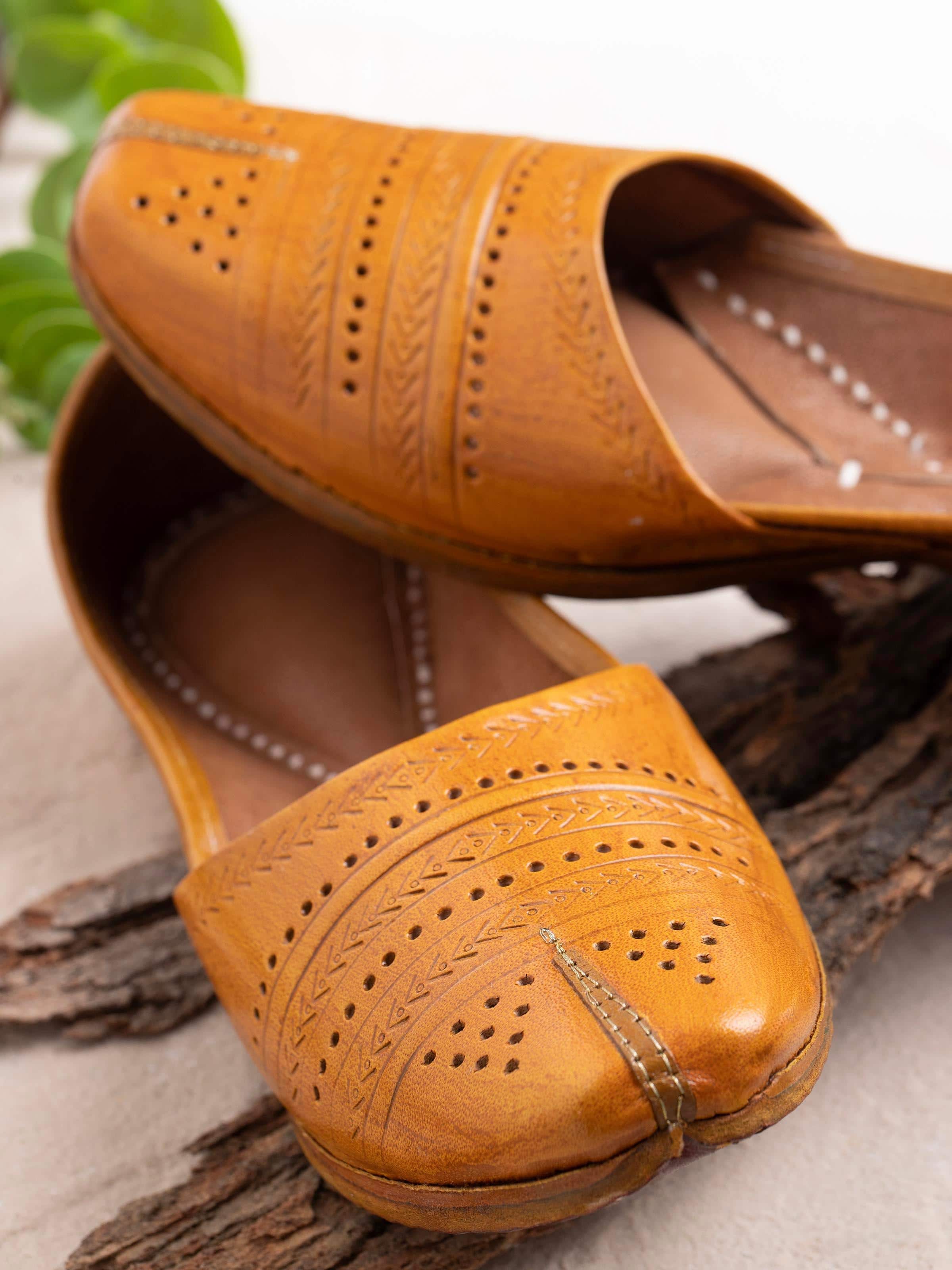 Close-up view of Tan Leather Haryana Punjabi Juttis showcasing the intricate embroidery and material.