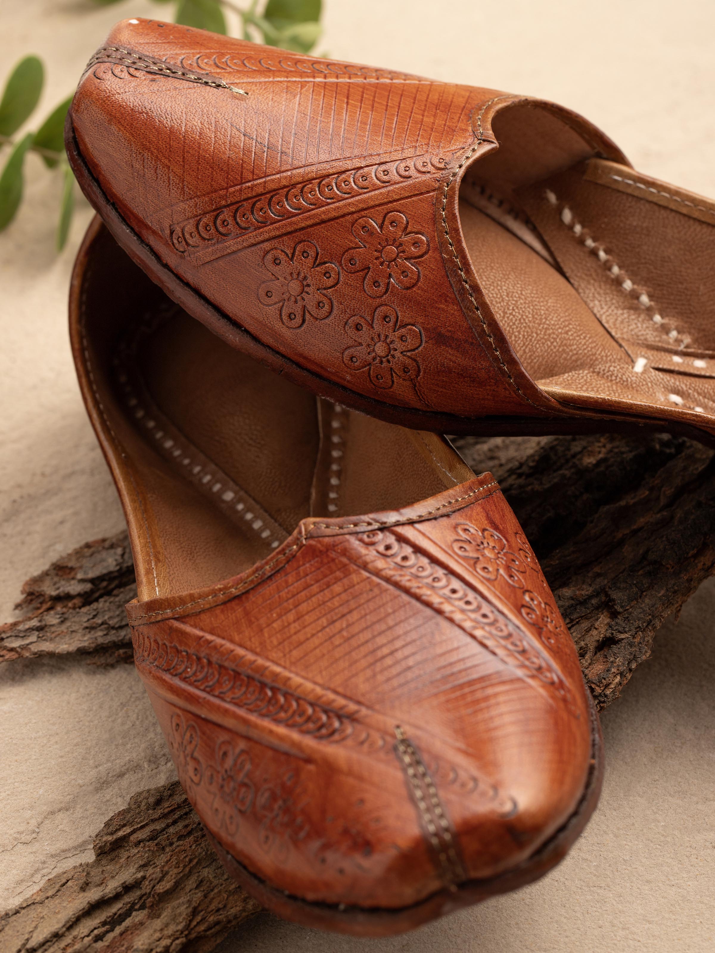 Close-up of Tan Leather Haryana Punjabi Juttis showing the detailed embroidery and texture.