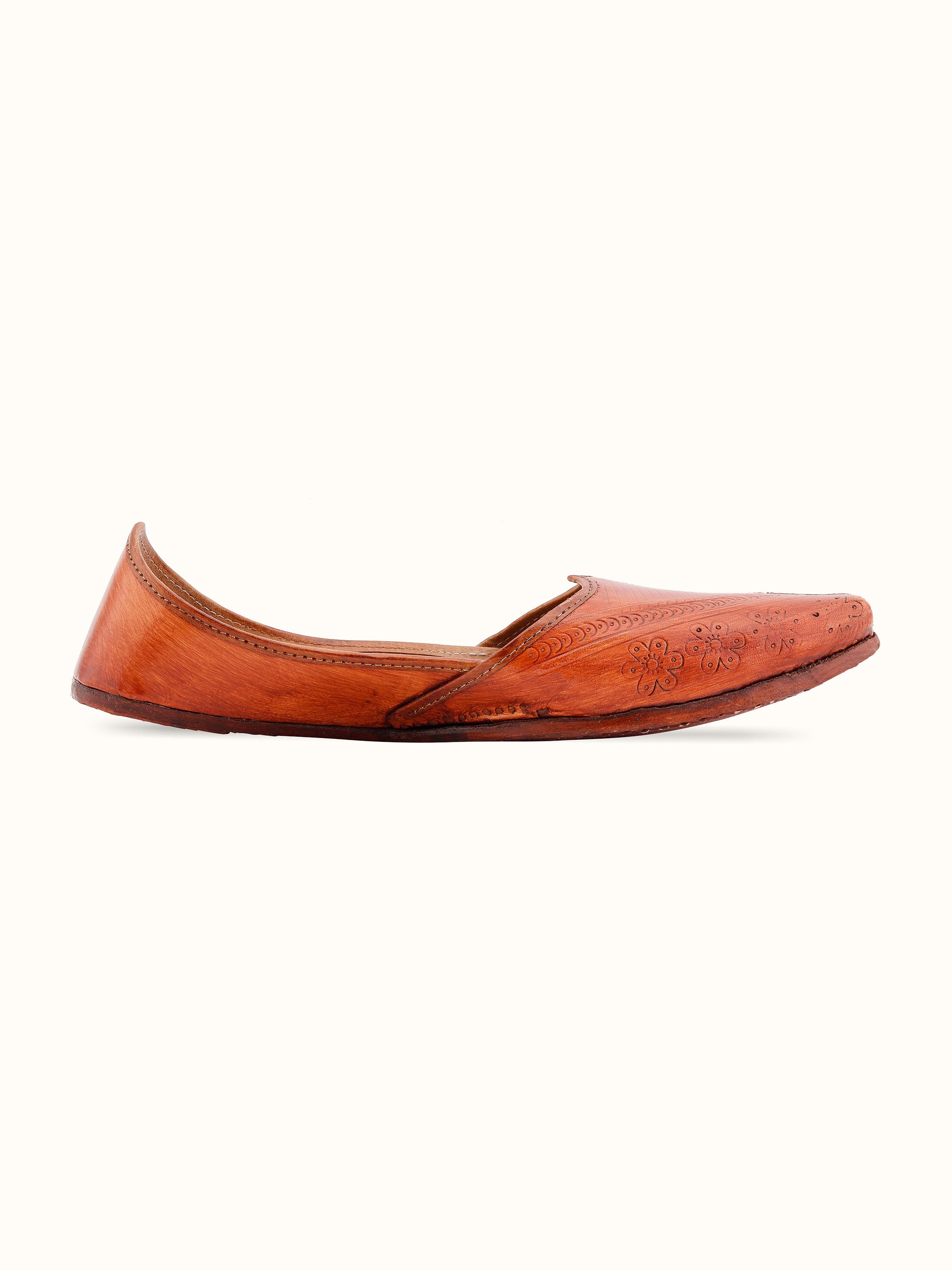 Angled view of Tan Leather Haryana Punjabi Juttis highlighting the design and craftsmanship.