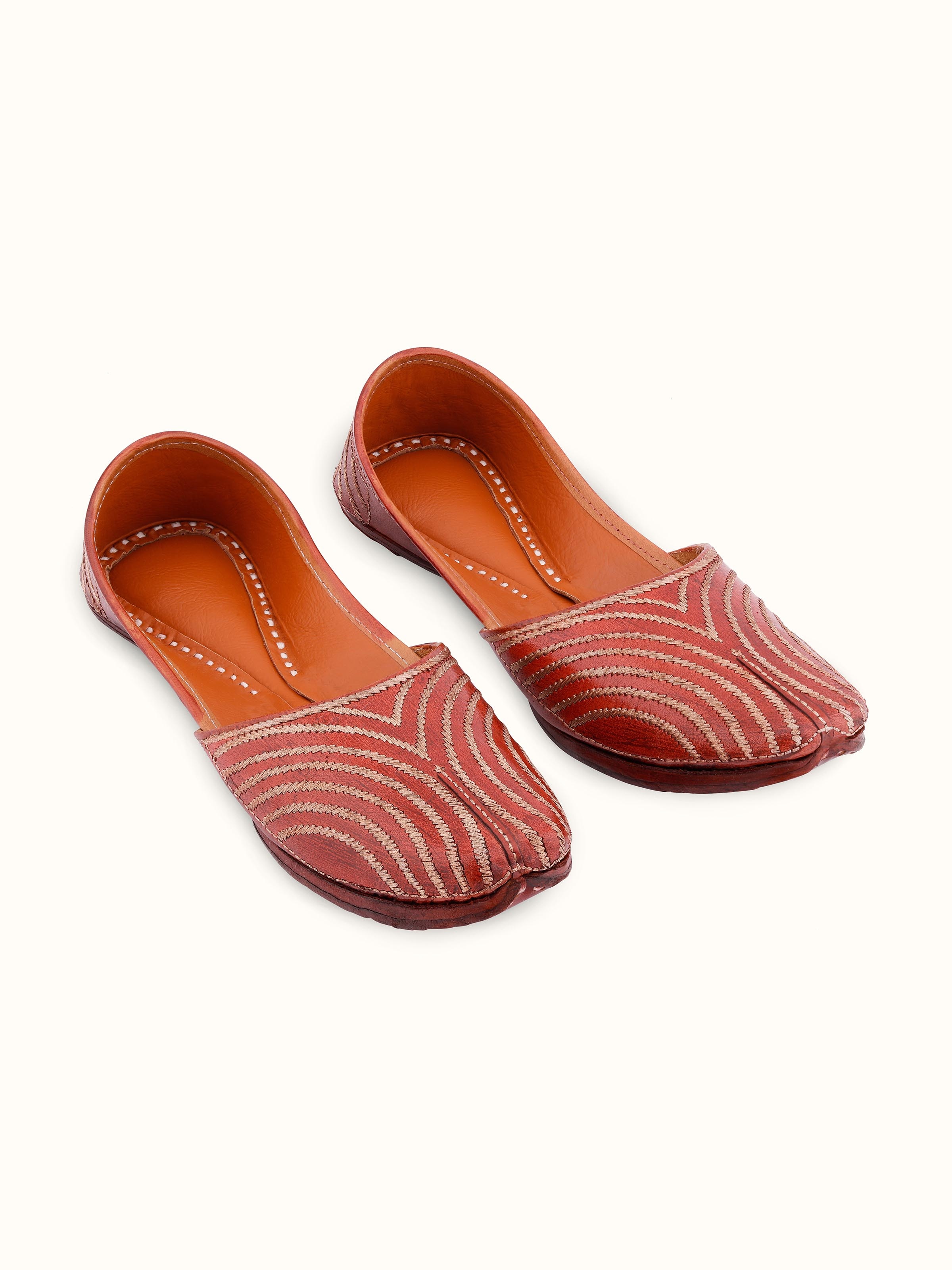 Front view of brown leather embroidered punjabi juttis showcasing intricate embroidery