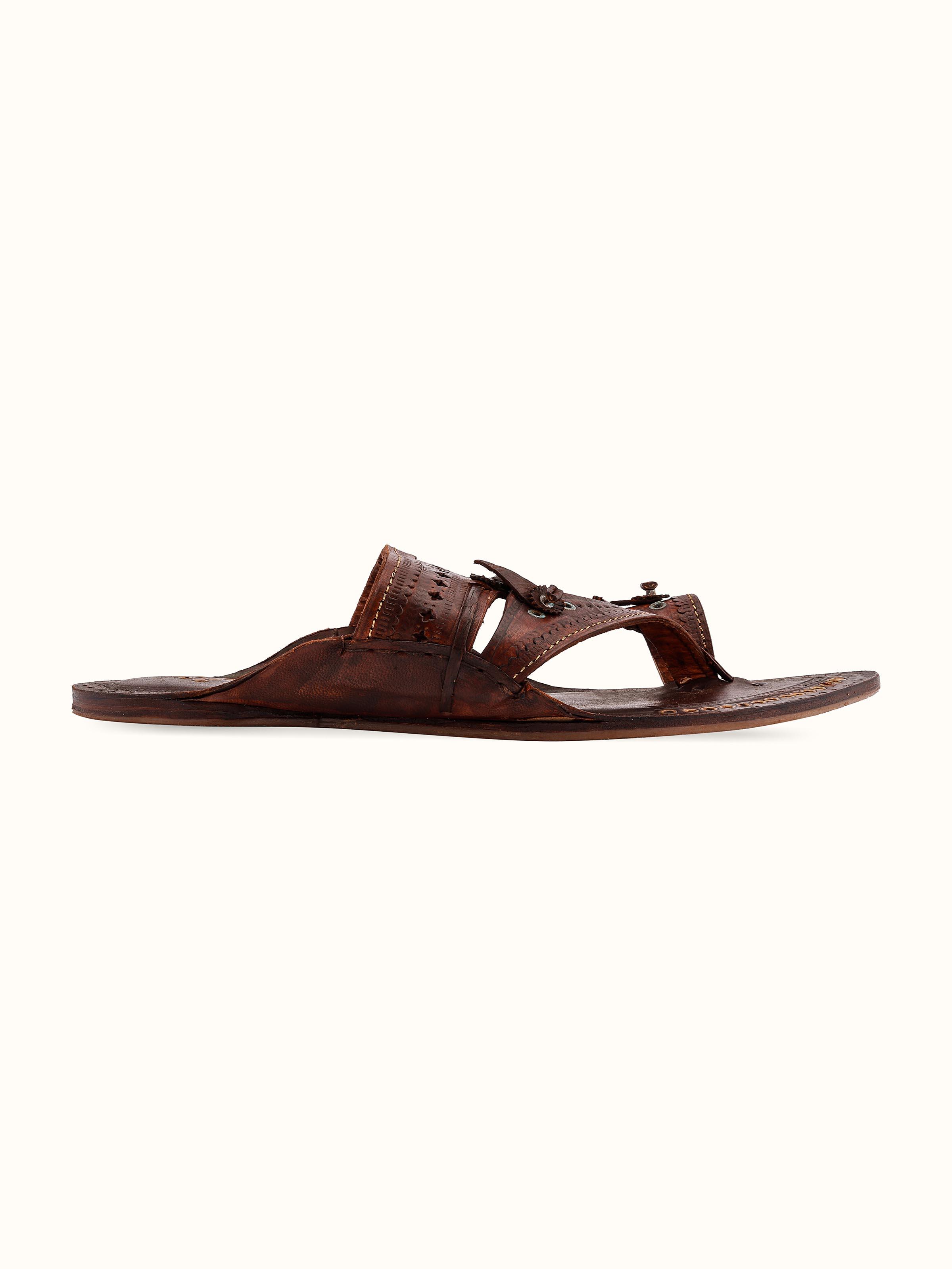 Back view of tan leather Kolhapuri chappals showing the overall design