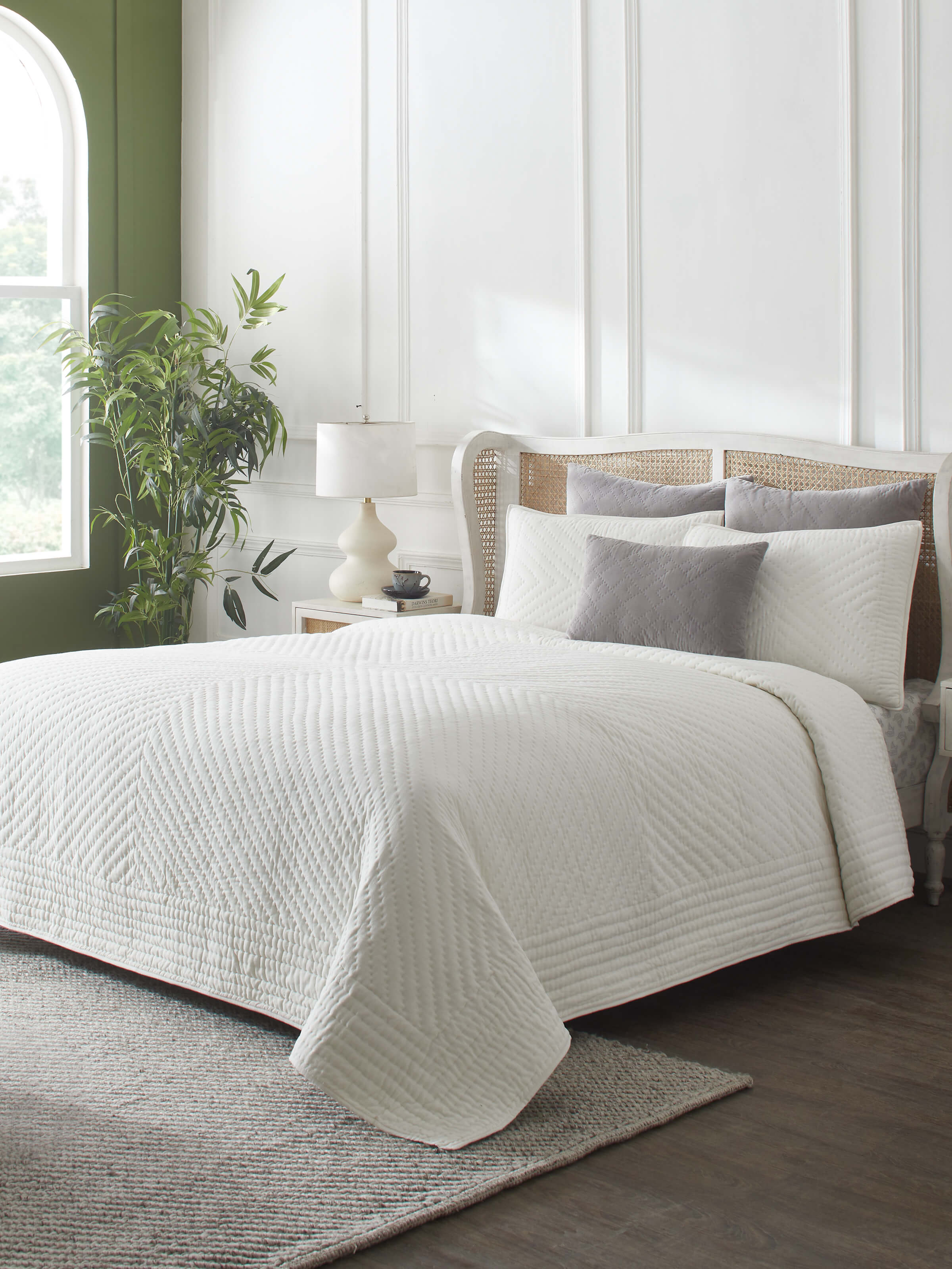 Close-up of the textured stripes on the Kapasa off-white cotton handloom bedspread