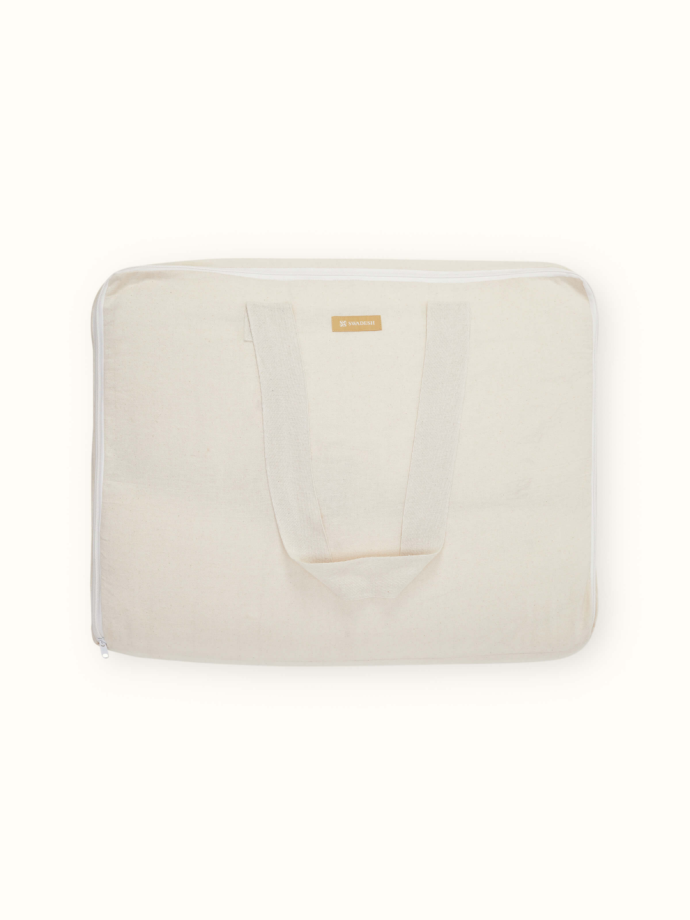 Kapasa off-white cotton handloom bedspread set folded neatly, highlighting its texture and color