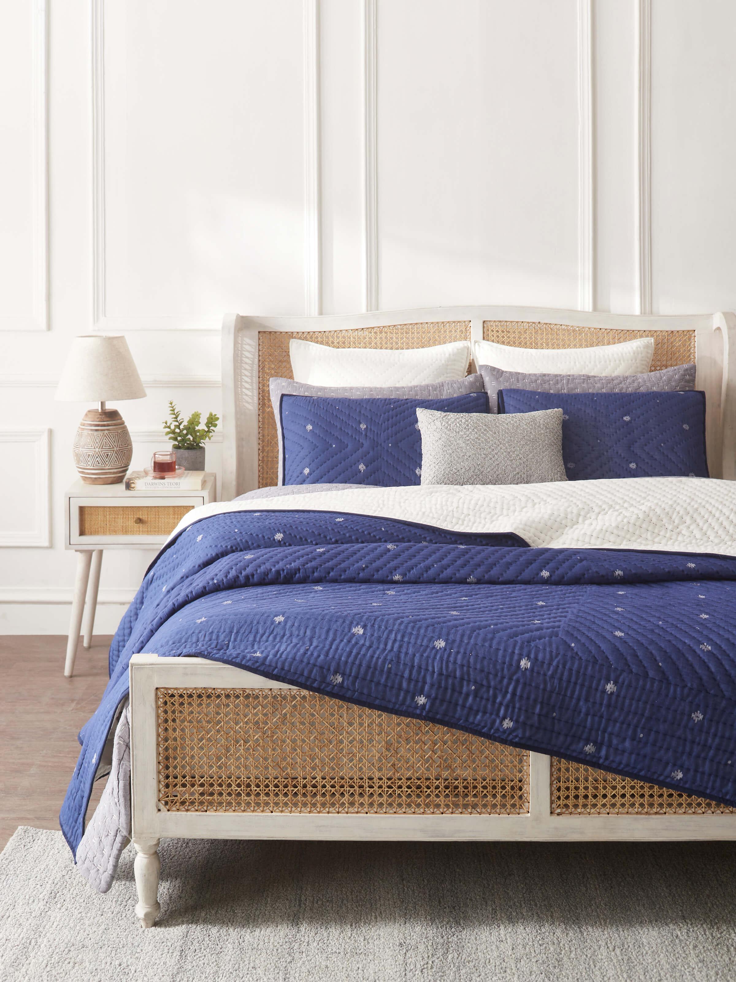 Close-up of Kalpanama indigo woven buti cotton quilt double showing the detailed weaving and color richness