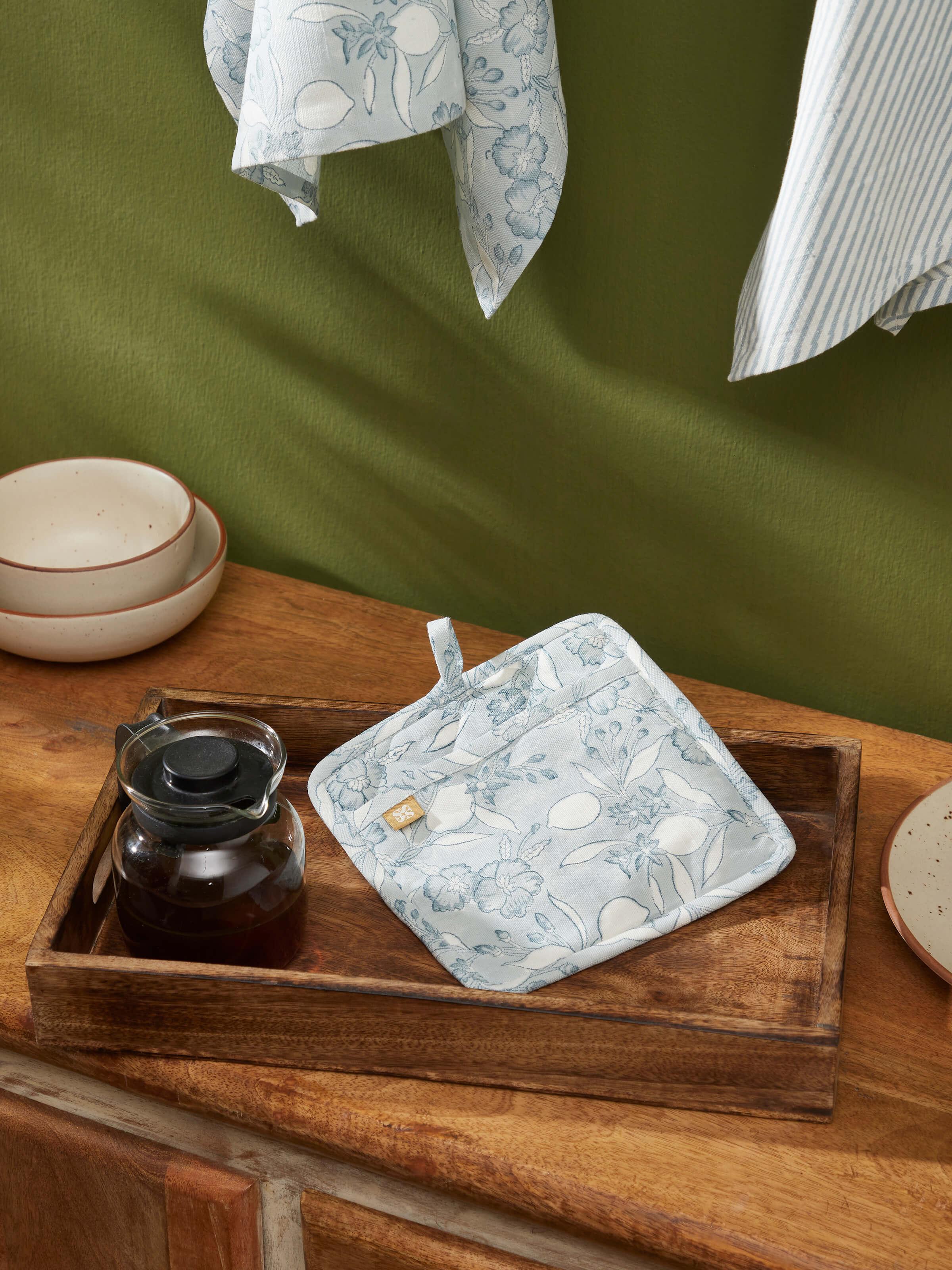 Close-up of Anika light blue floral cotton Sanganeri block printed pot holder showcasing the block print details and floral design.