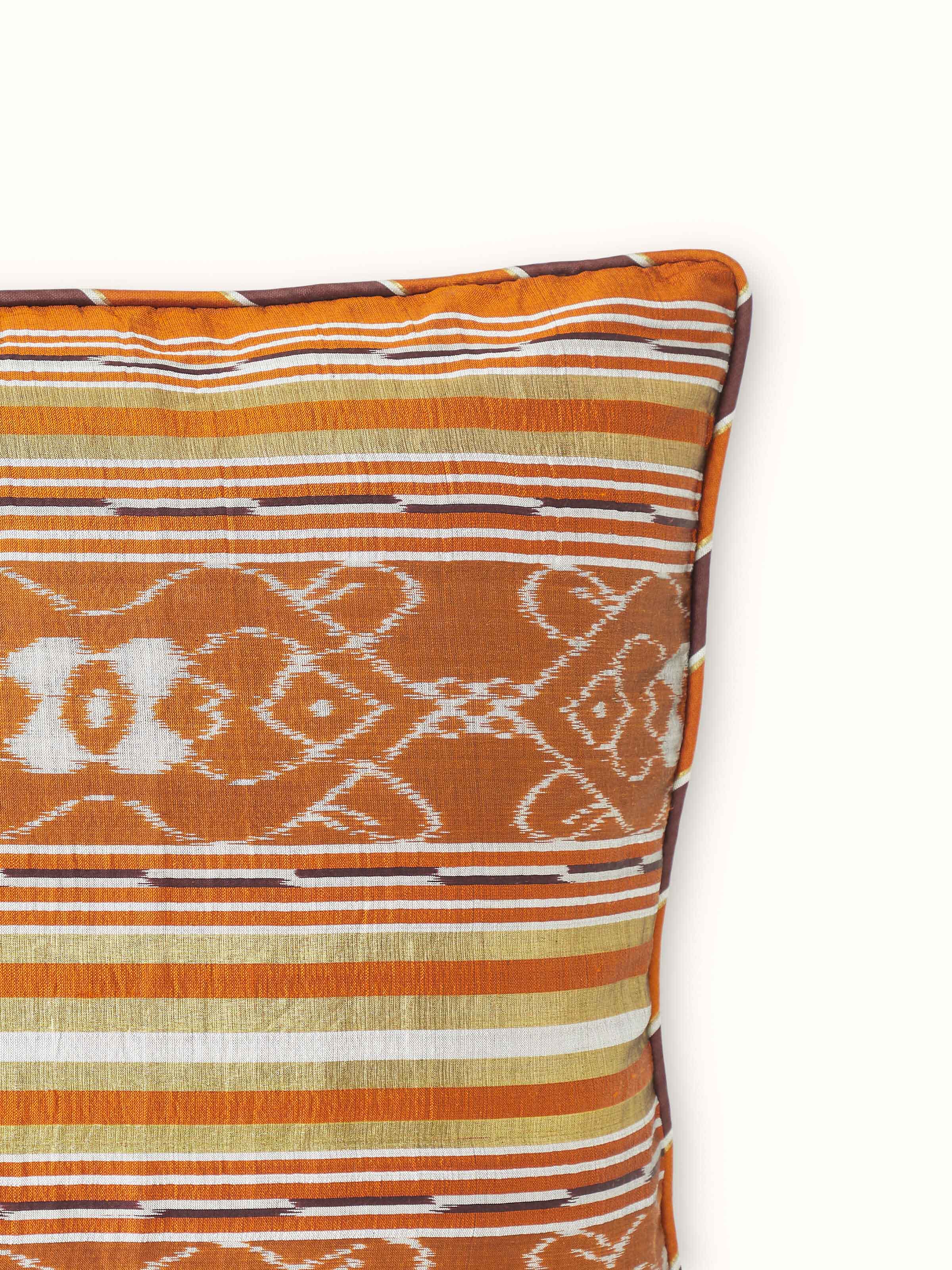 Back view of Sanchaya rust border stripe silk Odisha ikat handloom cushion cover, featuring the fabric’s back and closure details.