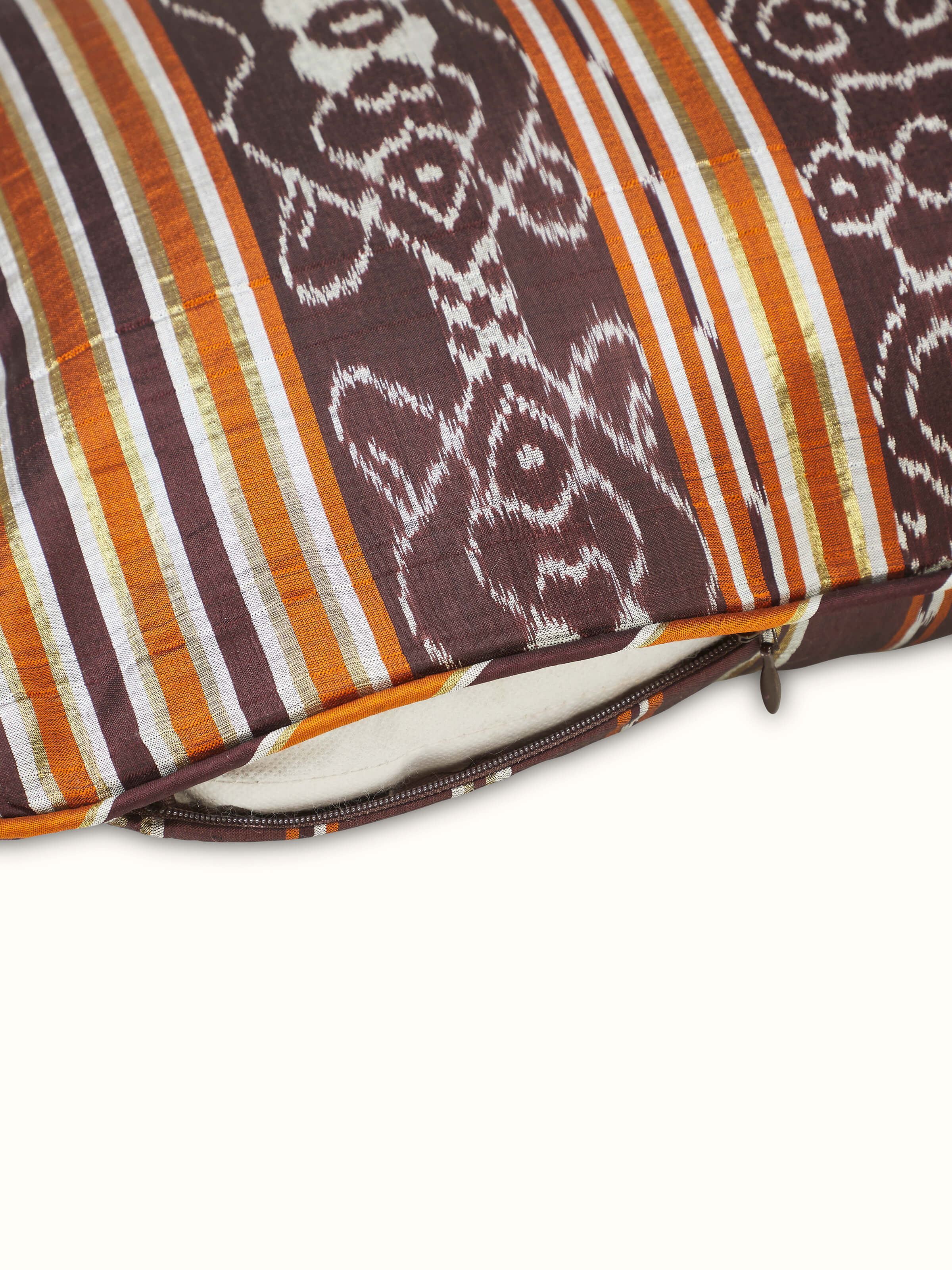 Sanchaya coffee stripe silk lumbar cushion cover from a different angle, emphasizing the traditional Ikat design and craftsmanship.