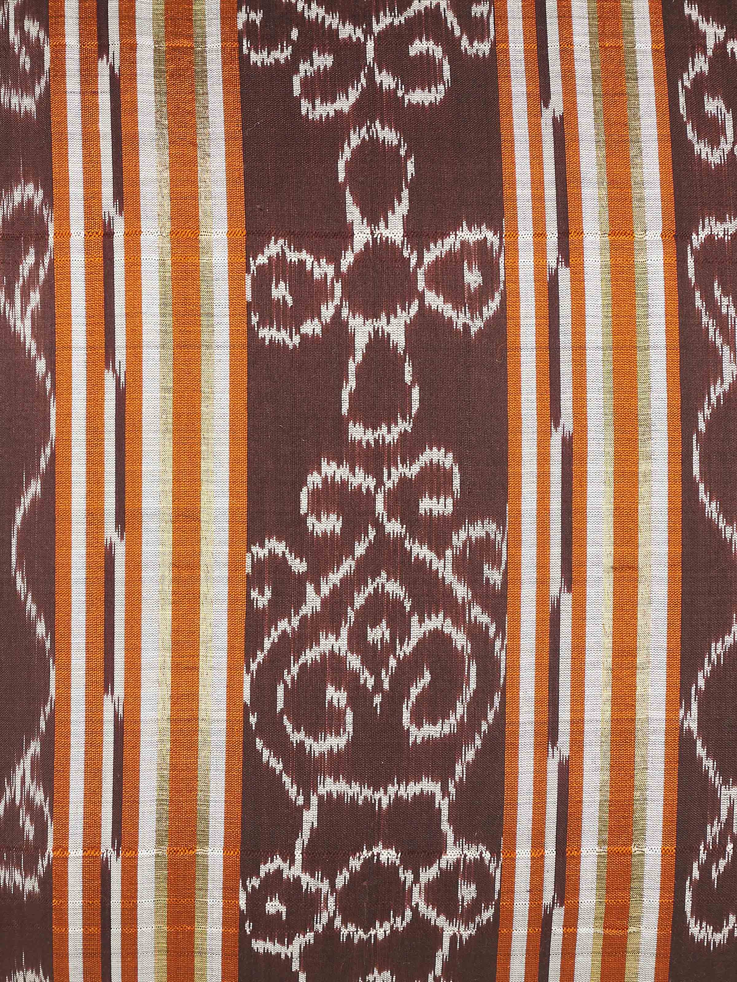 Close-up of Sanchaya coffee stripe silk lumbar cushion cover, highlighting the detailed Ikat pattern and texture.