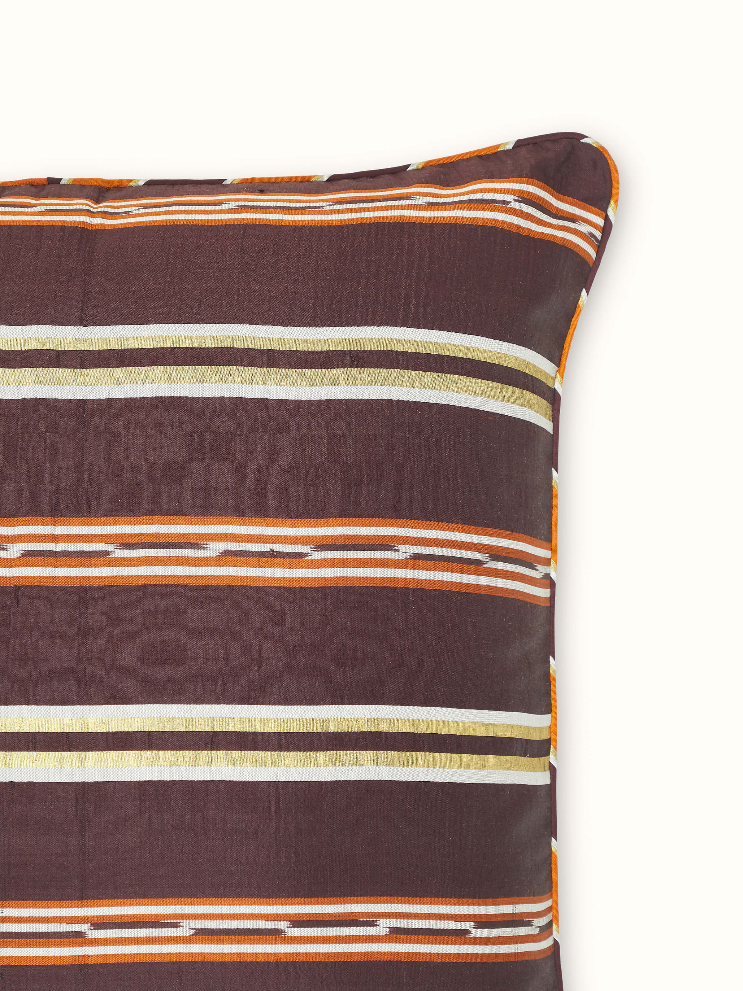 Angle view of Sanchaya Coffee Stripe Silk Odisha Handloom Ikat Cushion Cover displaying the overall design and texture.
