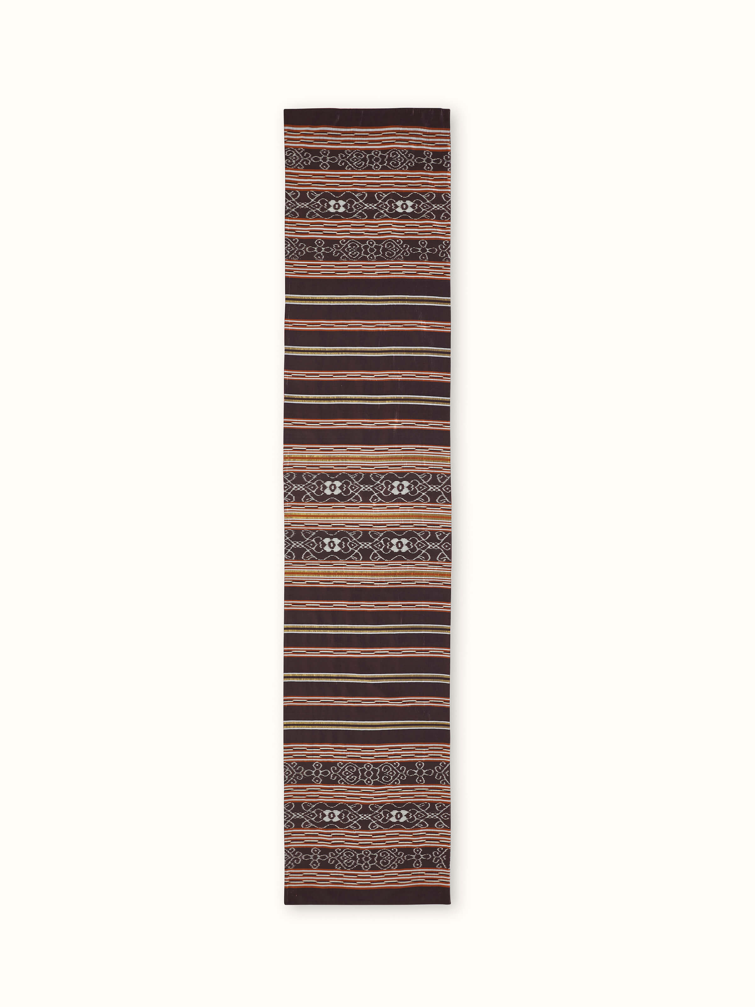 A front-facing view of the Sanchaya Coffee Stripe Silk Odisha Handloom Ikat Bed Runner by Swadesh, highlighting the linear striped design and rich silk Ikat weaving.