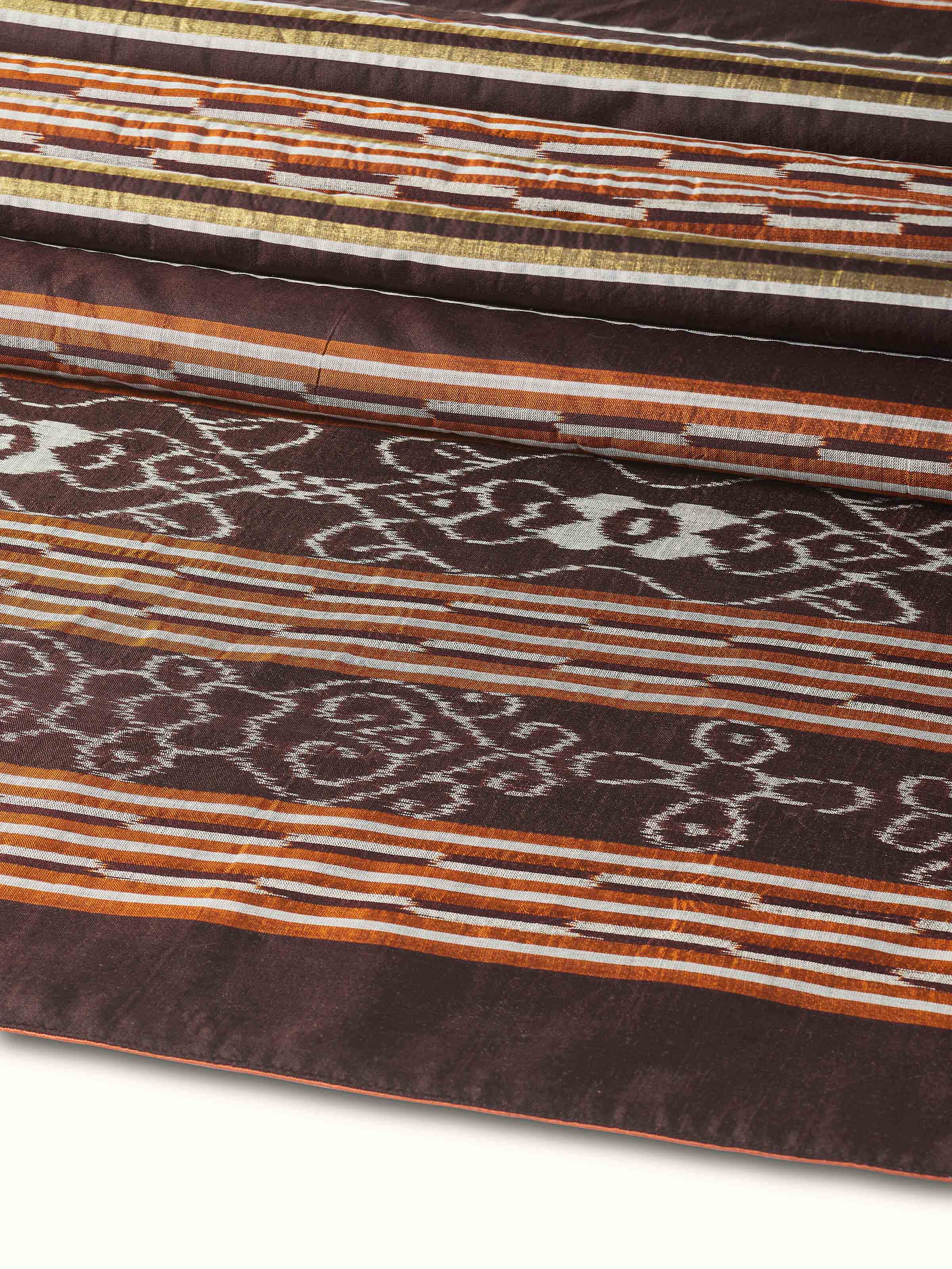 A back view of the Sanchaya Coffee Stripe Silk Odisha Ikat Bed Runner, displaying the reverse weave and texture of the handloom silk fabric.