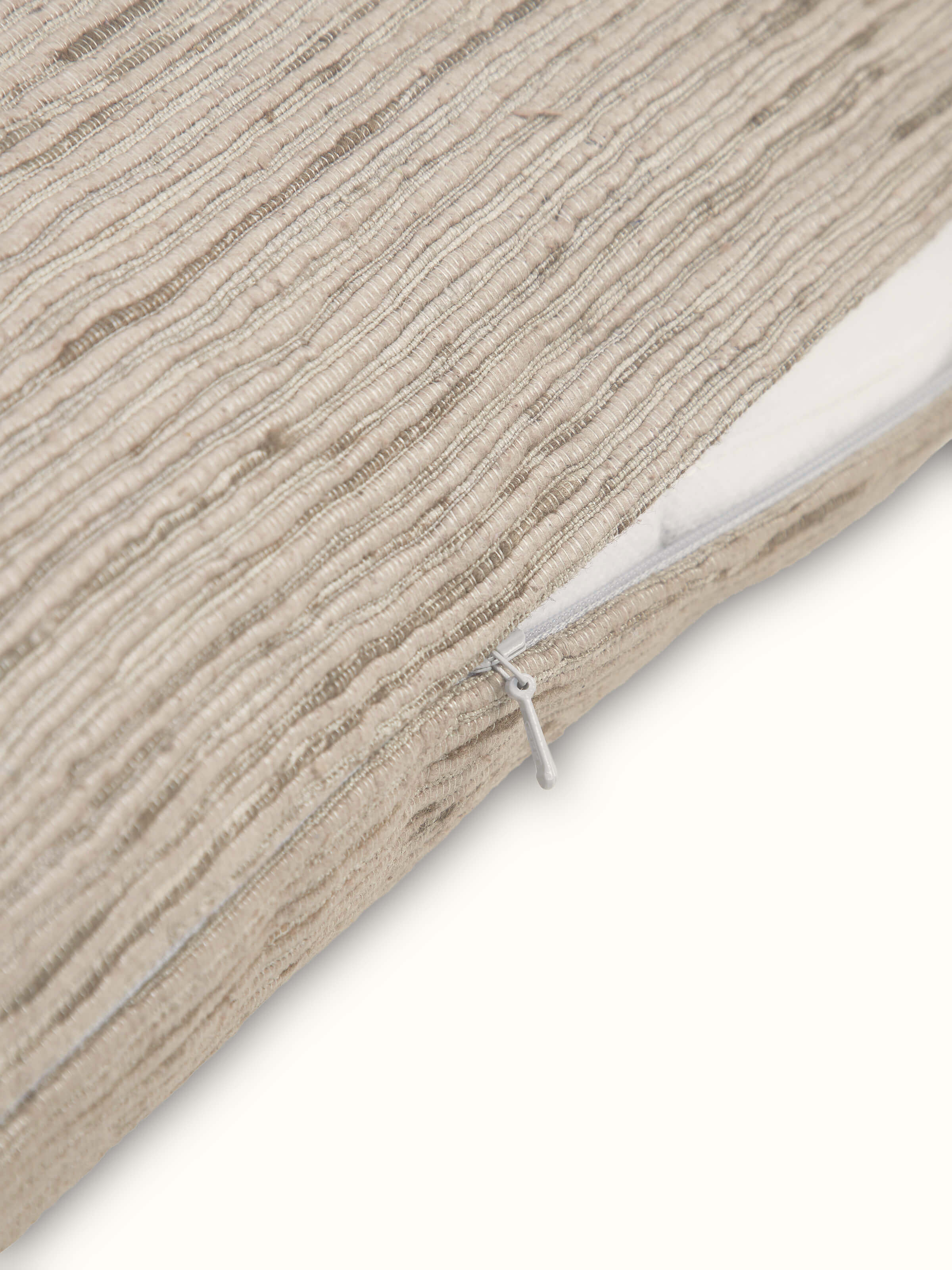 Angled view of cushion highlighting the sheen and woven pattern of Bhagalpuri silk.