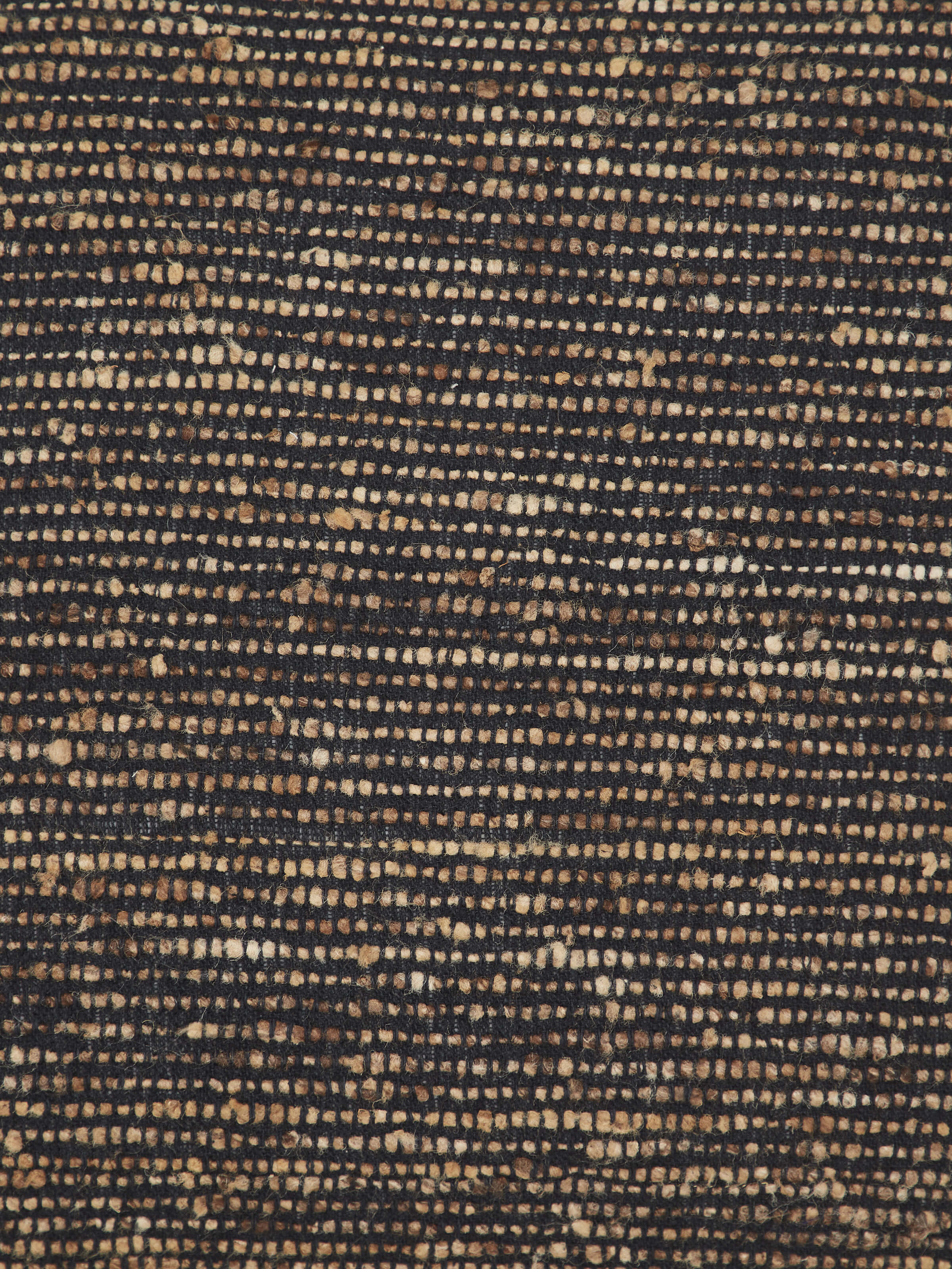 Side view of Ujjal Black Kaya silk handloom cushion cover emphasizing the fabric's texture and quality