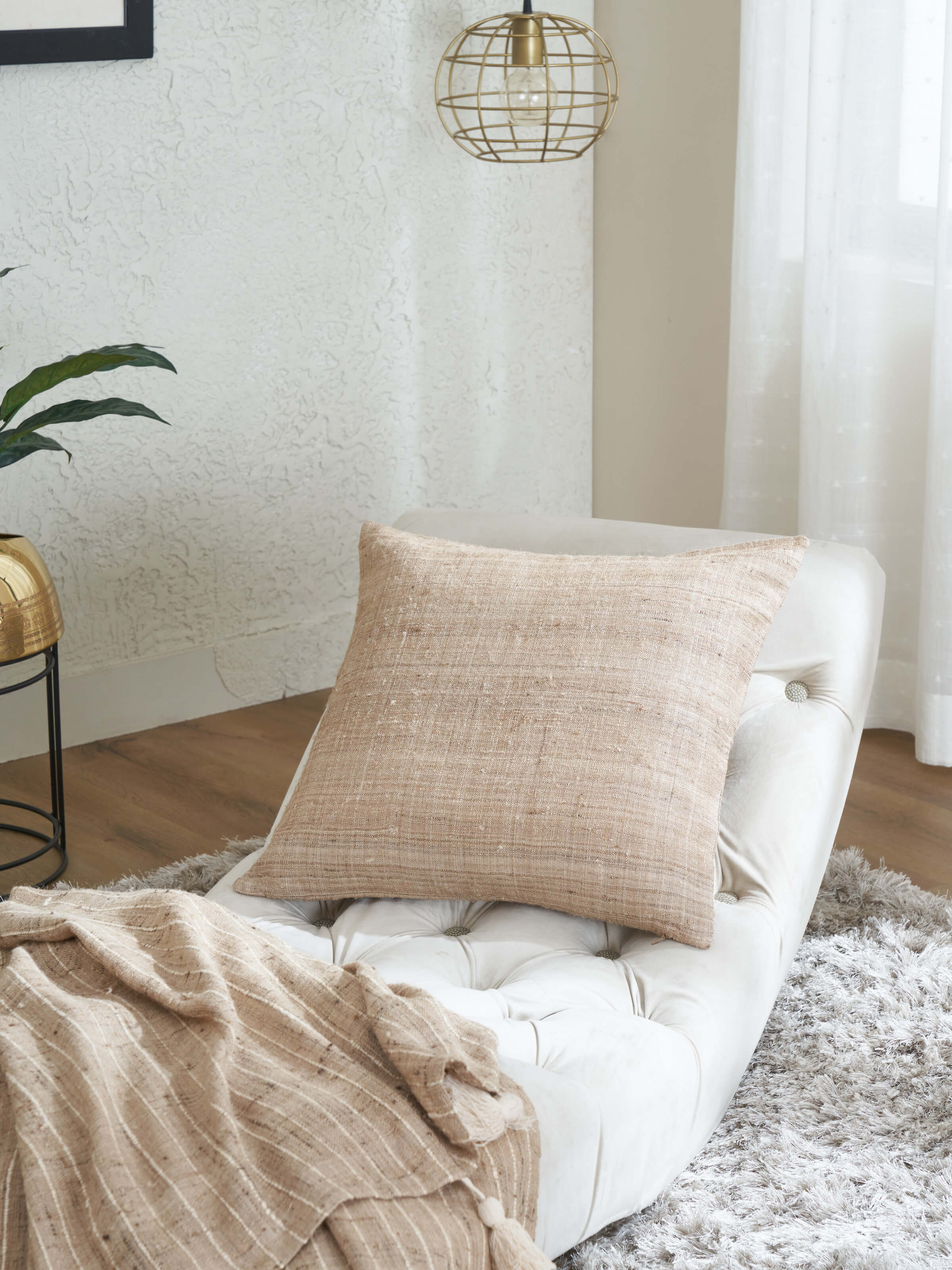 Side view of Ujjal light brown dharana silk slub handloom cushion cover highlighting the intricate weave and design