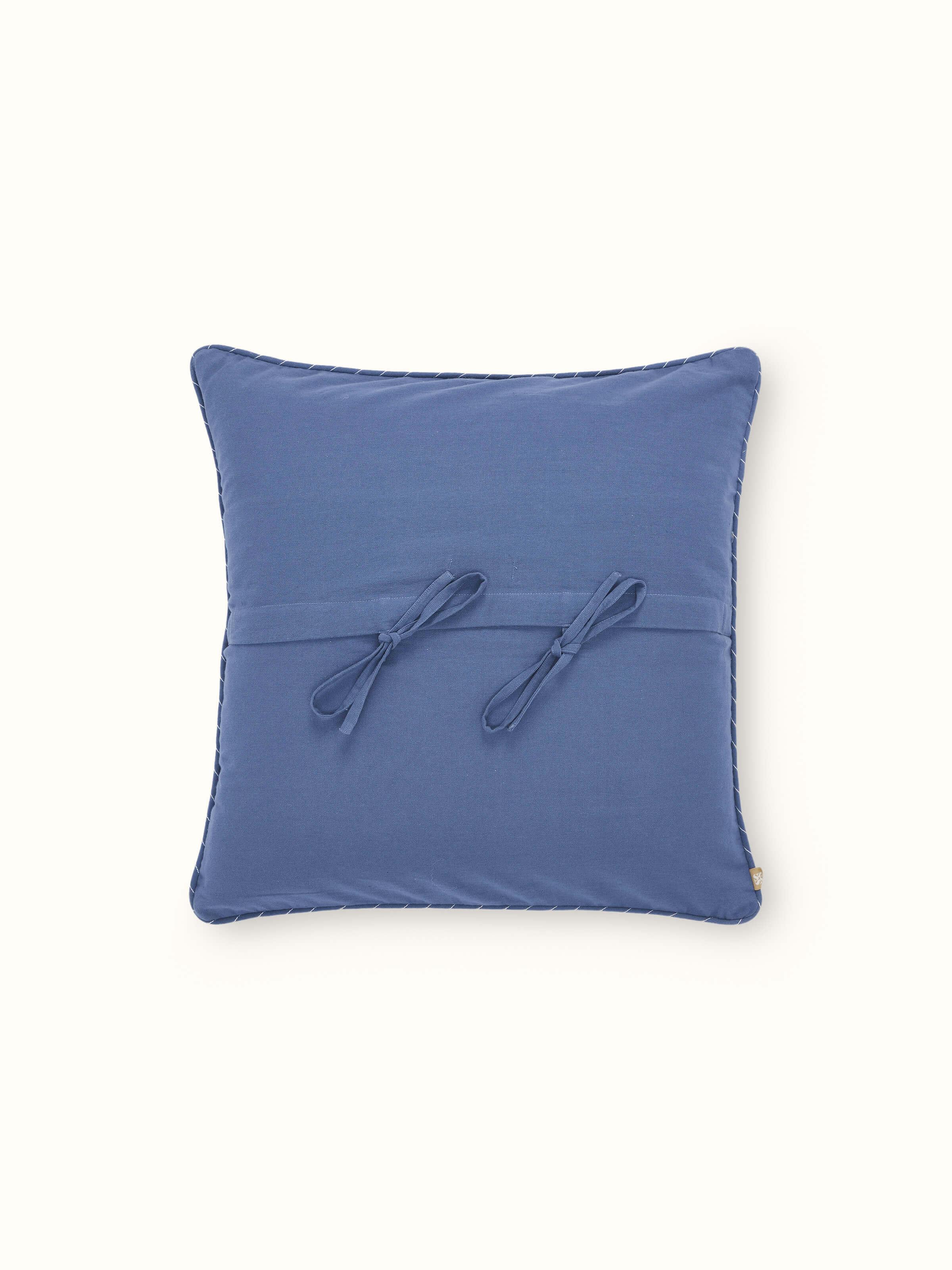 Back view of the Rann blue cushion cover with button closure and cotton weave texture.