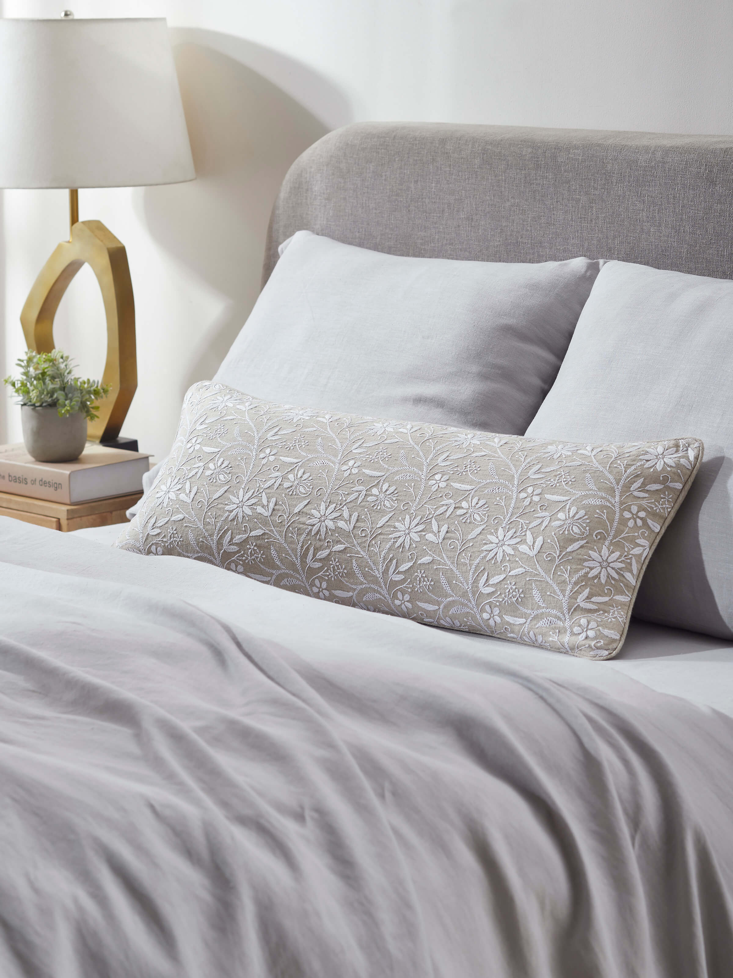 Close-up of Rann beige allover cotton Chikankari hand embroidered cushion cover showcasing the detailed hand embroidery and fine cotton fabric.