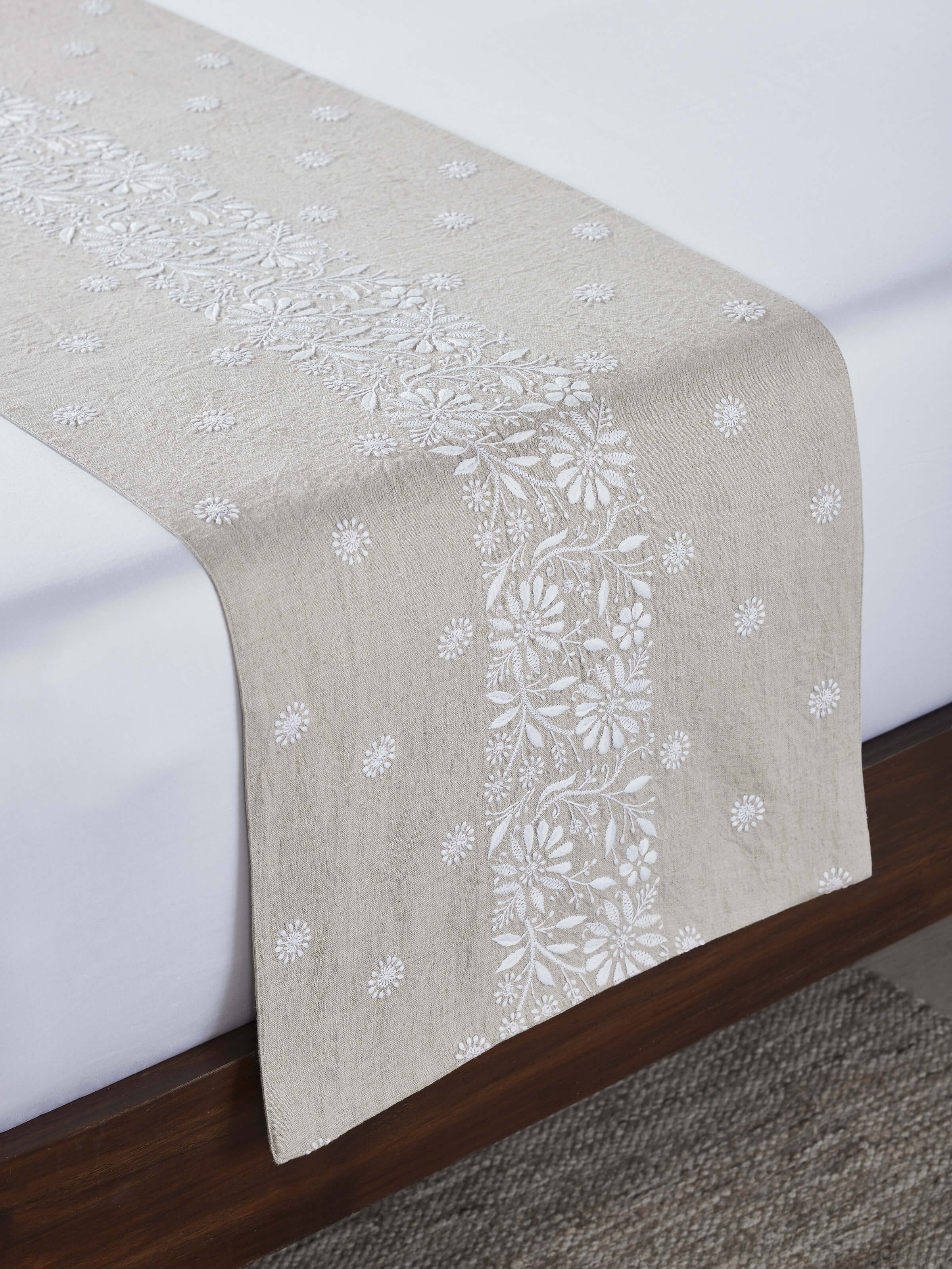 Top view highlighting intricate floral chikankari embroidery and border detailing.