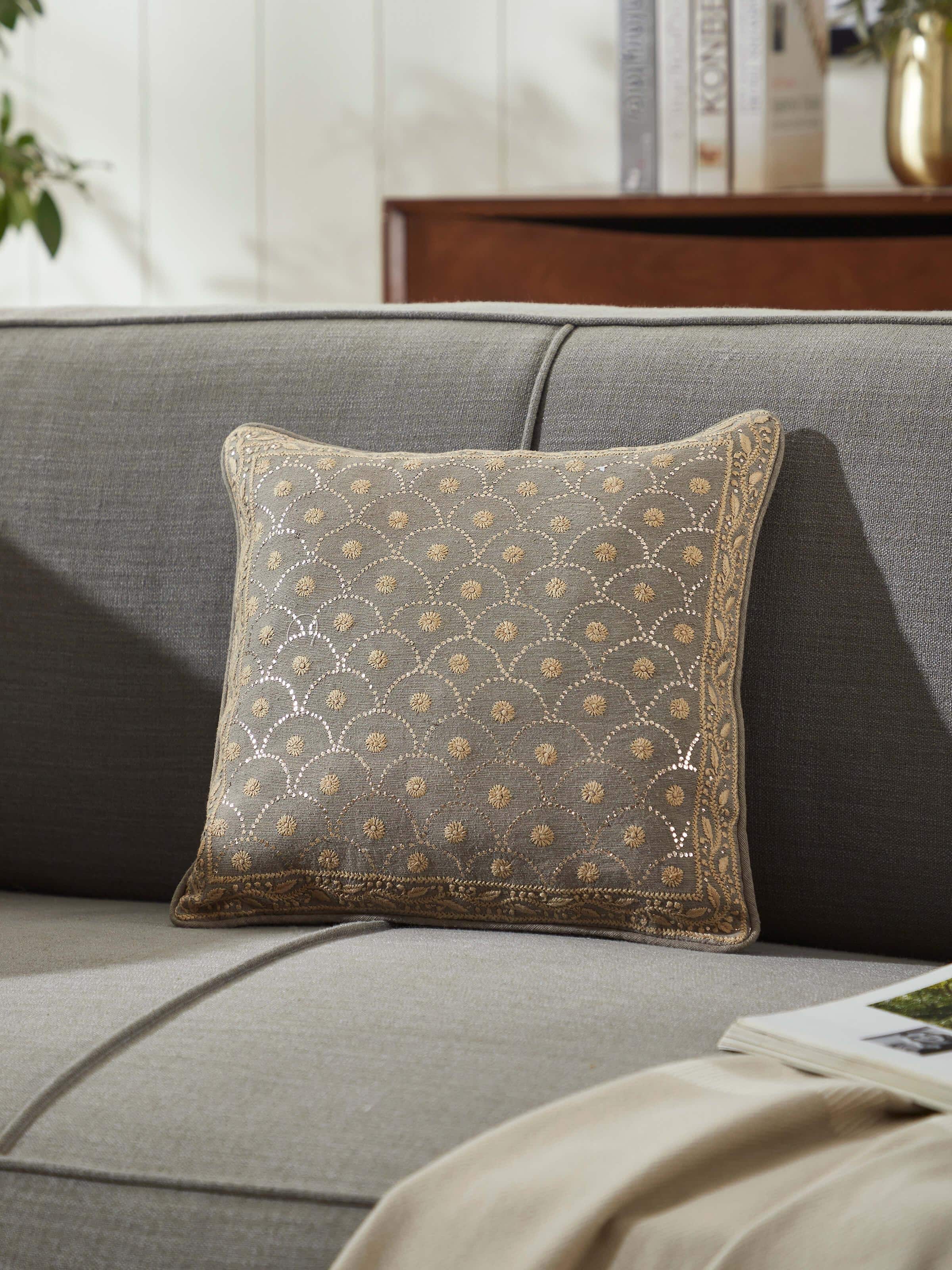 Lifestyle image of Pragya Chikankari cushion adding elegance to a modern sofa setting
