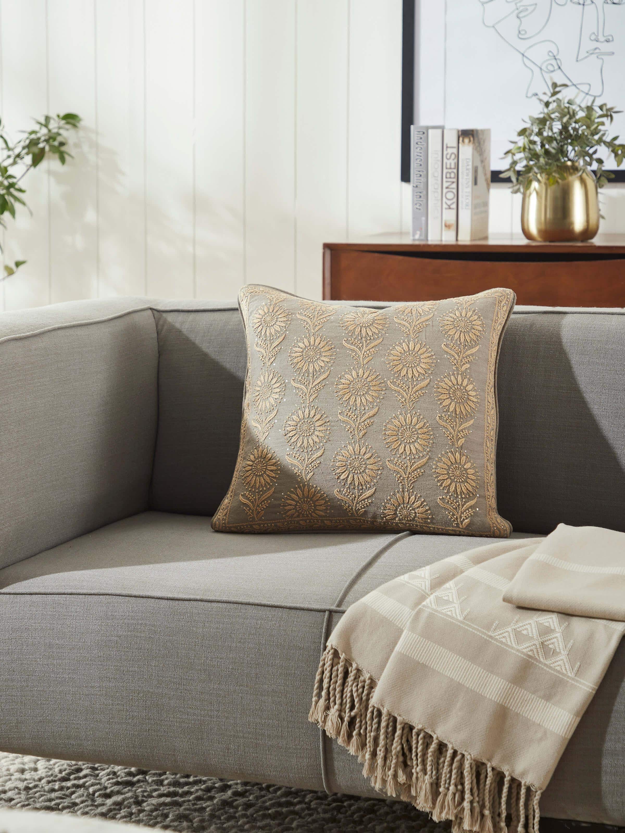 Side view of Pragya Grey Buta Silk Chikankari Hand Embroidered Cushion Cover highlighting the hand-embroidered details and luxurious silk fabric.