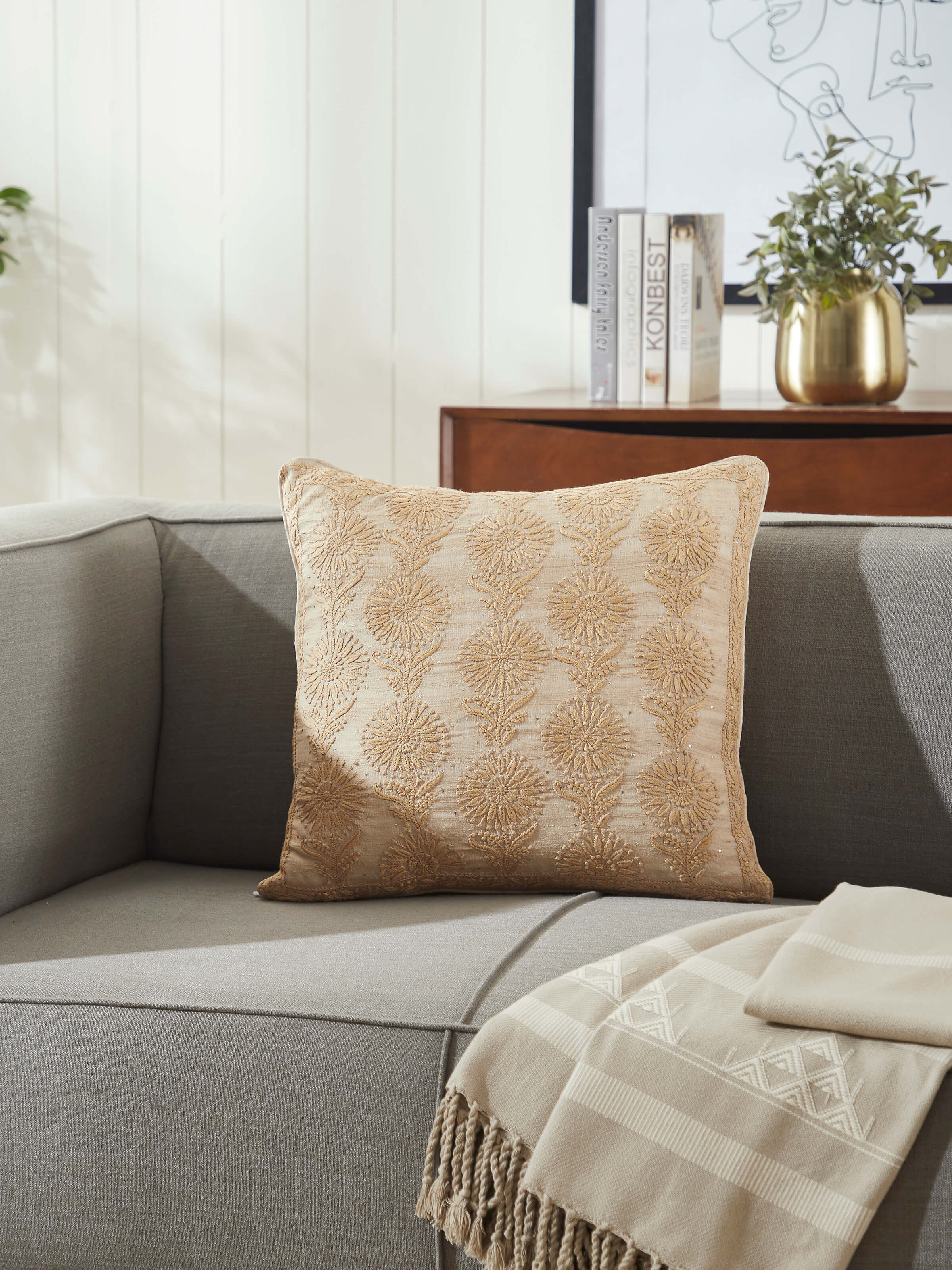 Lifestyle image of Pragya Chikankari Cushion Cover on a sofa, adding artisanal elegance.