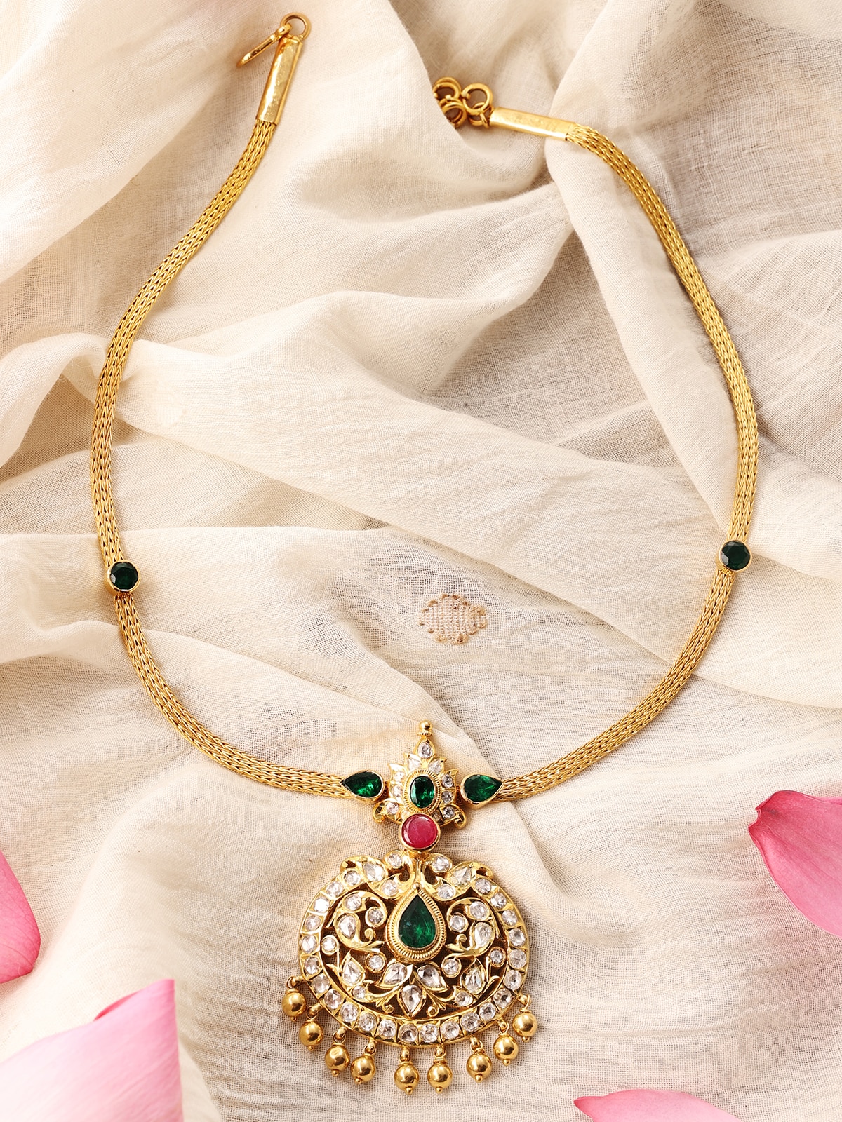 Angled view emphasizing the smooth curves and fine finish of the necklace