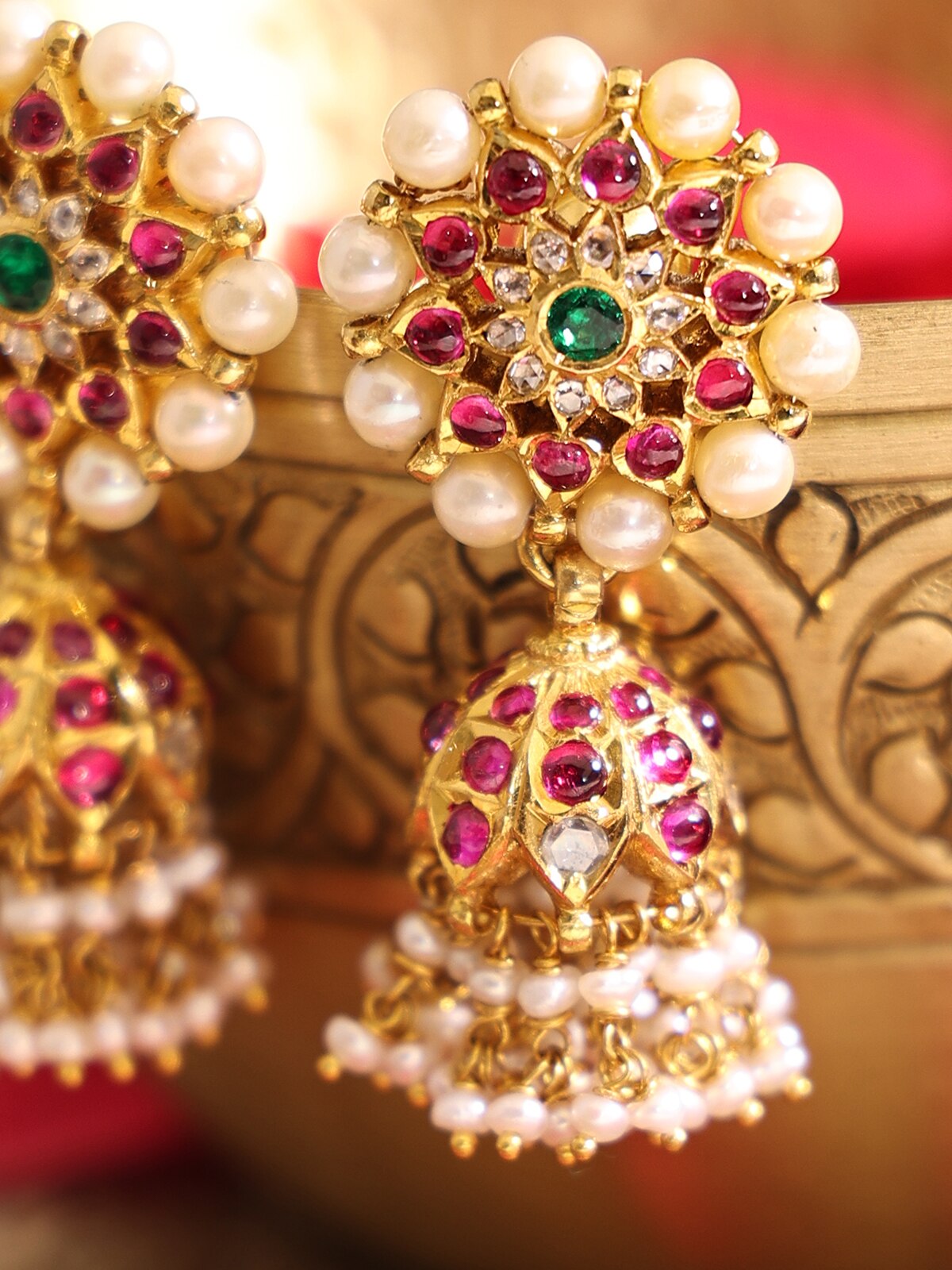 Detailed view of Kundala Velai 22 Karat Gold Jhumkas highlighting their intricate design and high-quality gold.