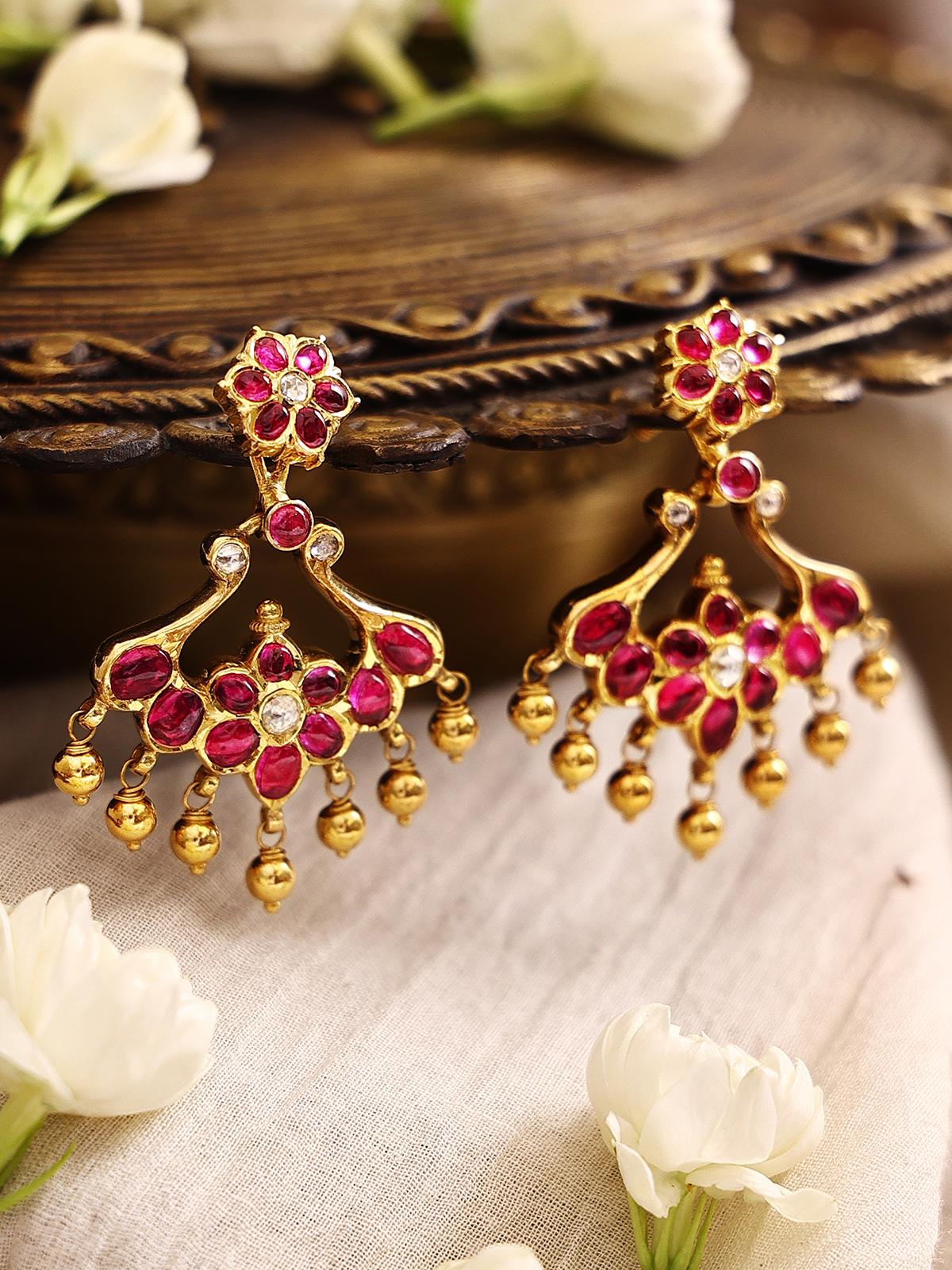 Close-up view of Kundala Velai 22 Karat Gold Jhumkas highlighting detailed craftsmanship and gold finish.