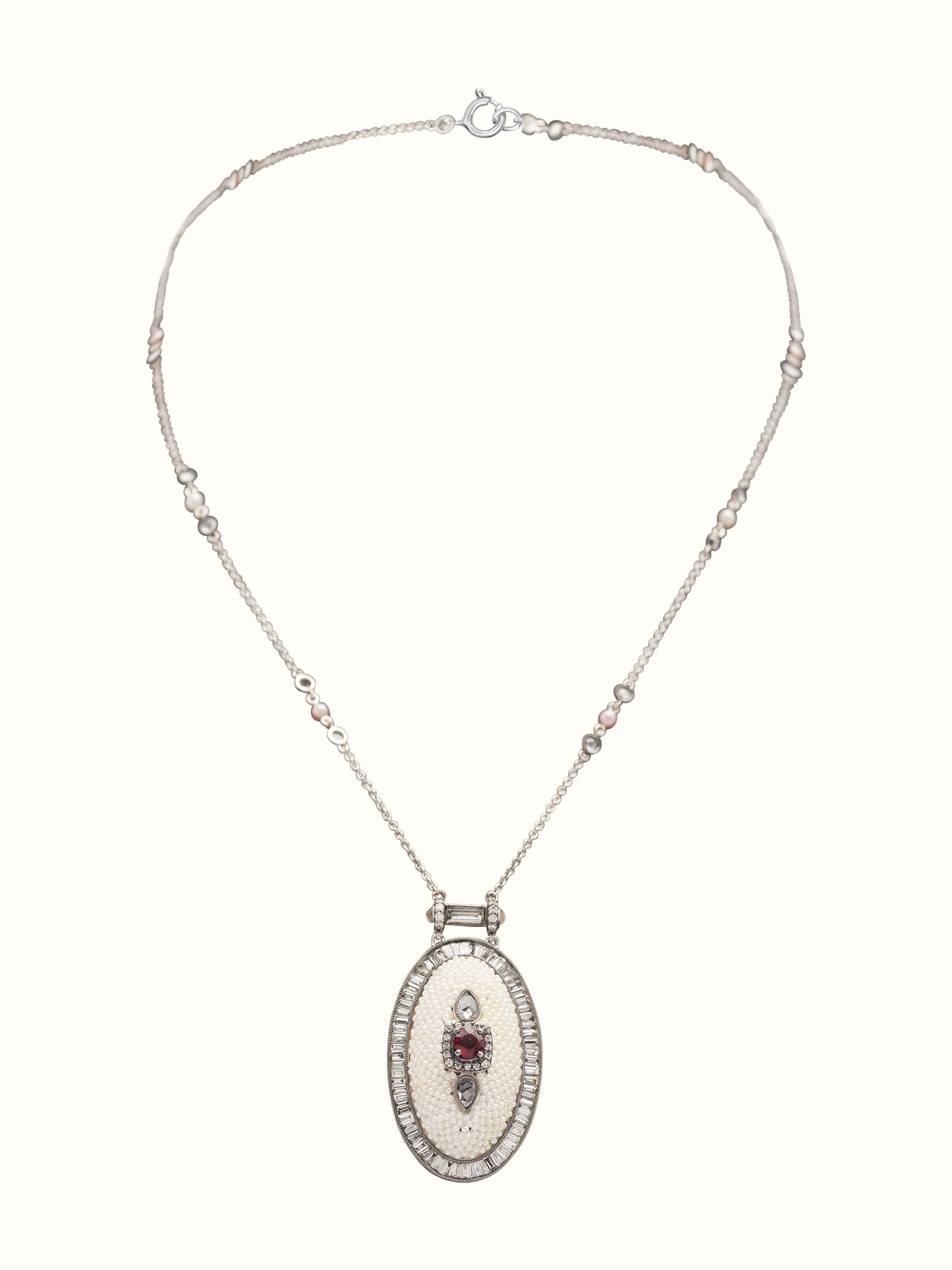 Front view displaying the elegant gold pendant with pearl accent