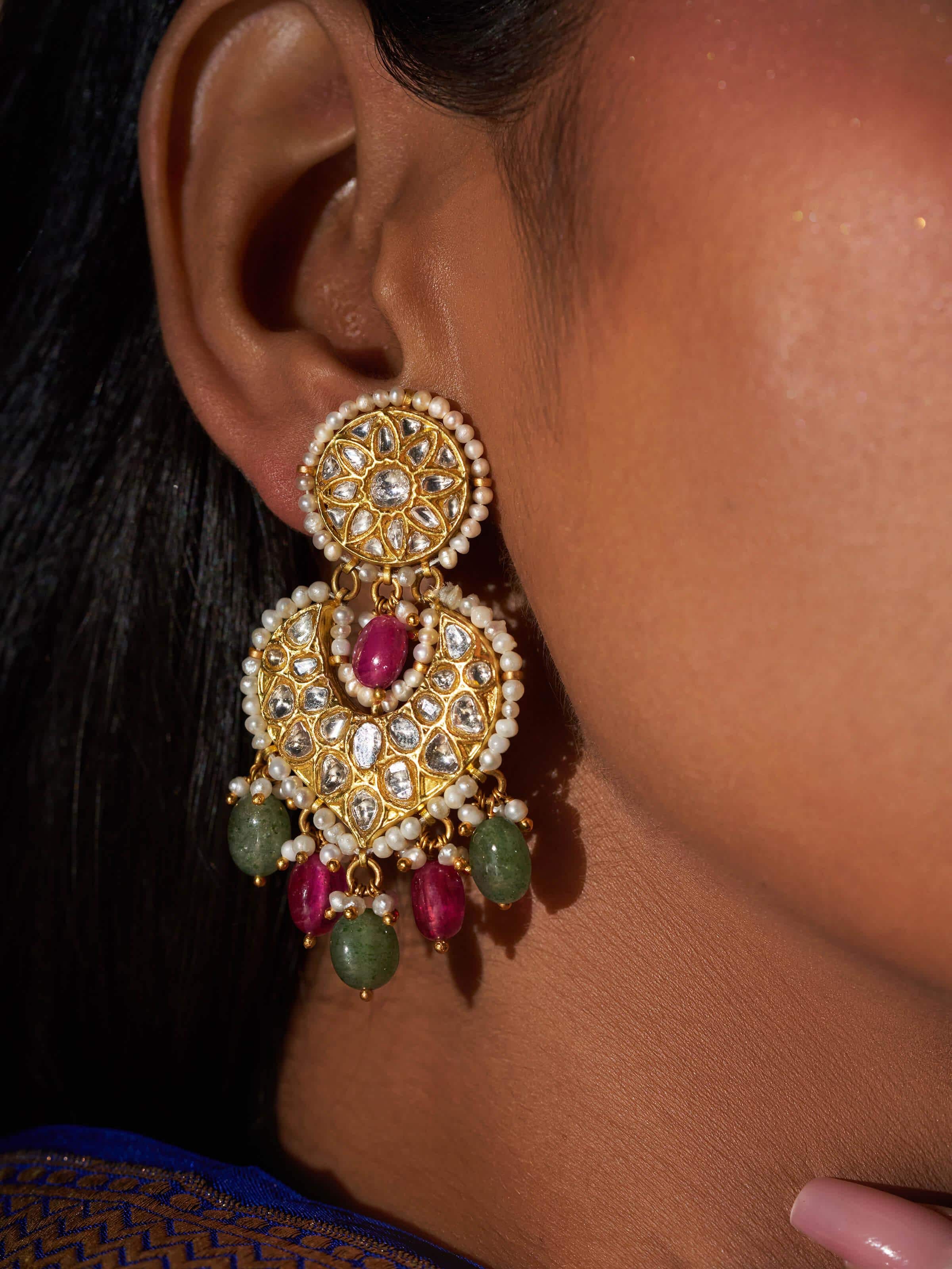 Side view revealing the depth and polish of the earrings