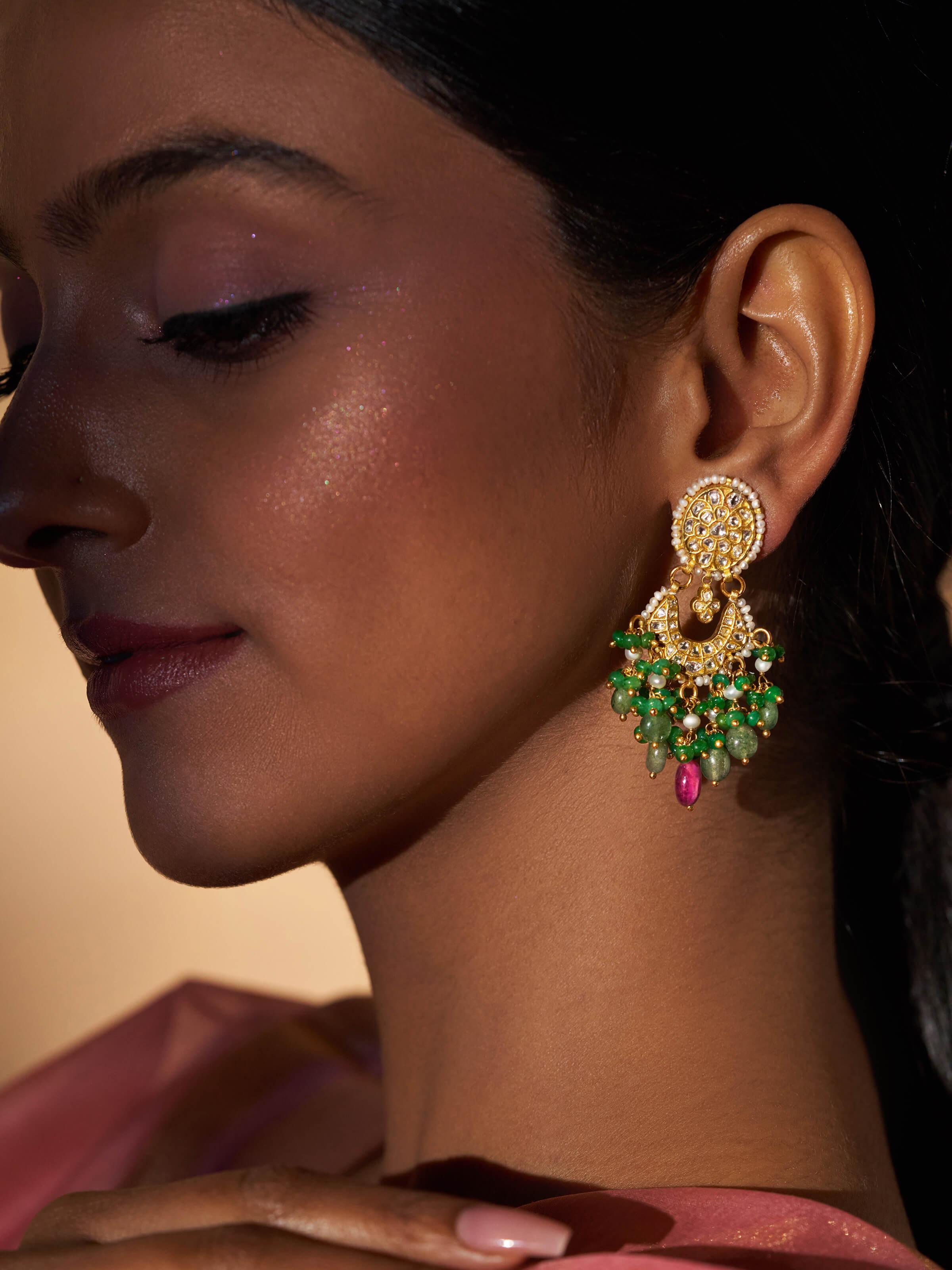 Close-up of Thappa 22 karat gold drop earrings highlighting intricate gold craftsmanship