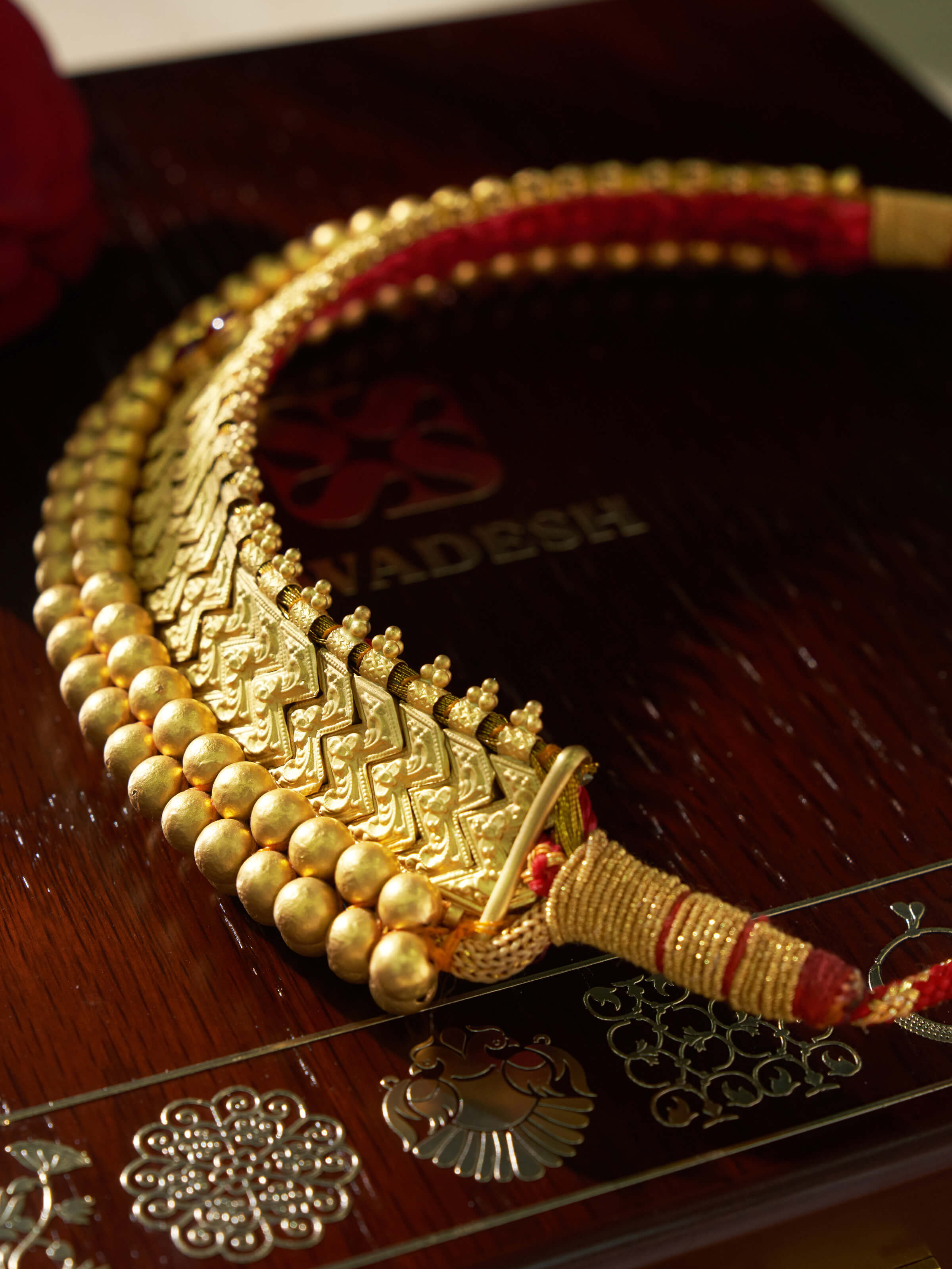 Overhead view of Thushi 22 Karat Gold Choker showcasing its sophisticated design and luxurious finish