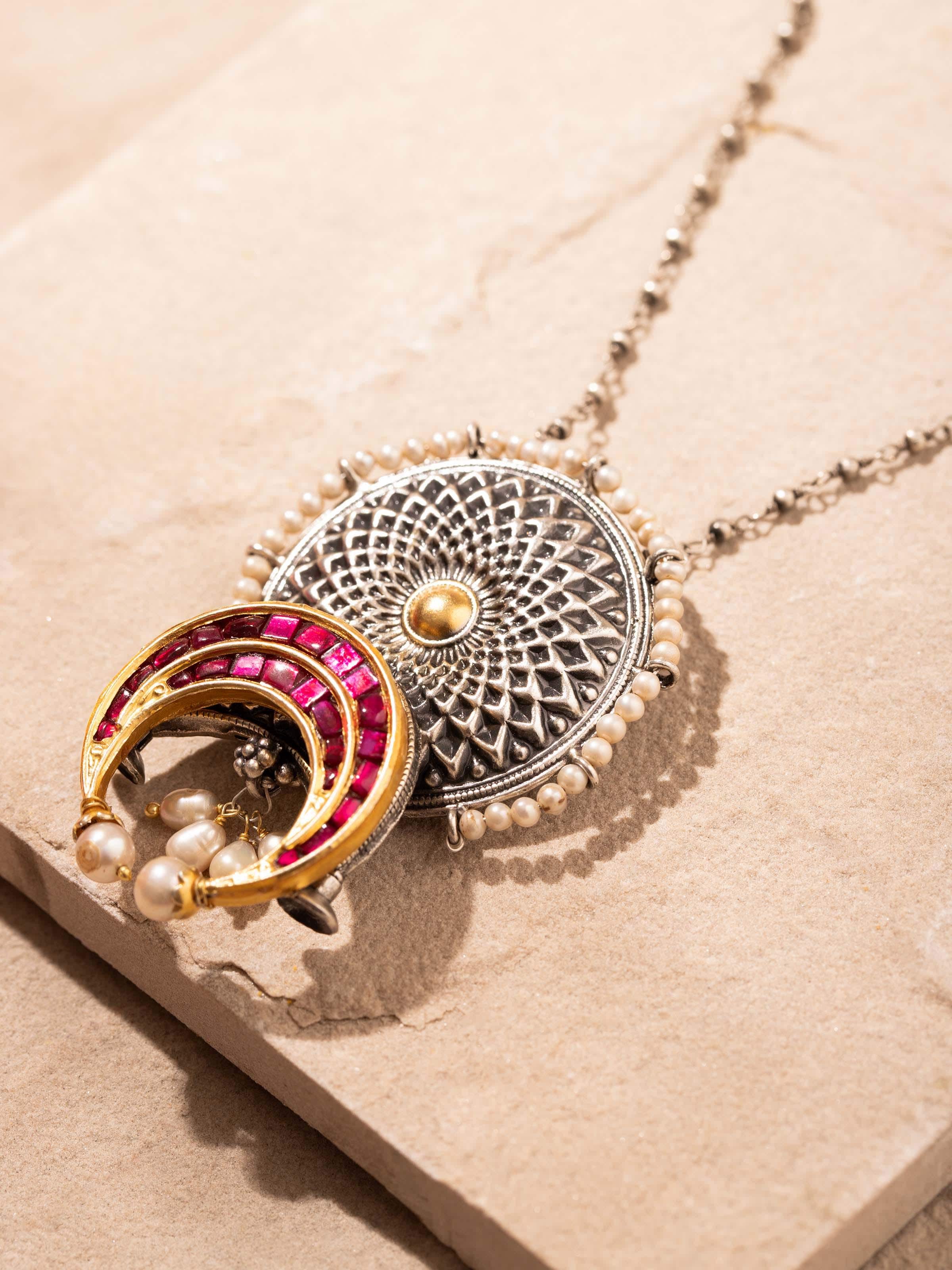 Detailed front view of silver smithing pendant & chain showcasing its elegant style