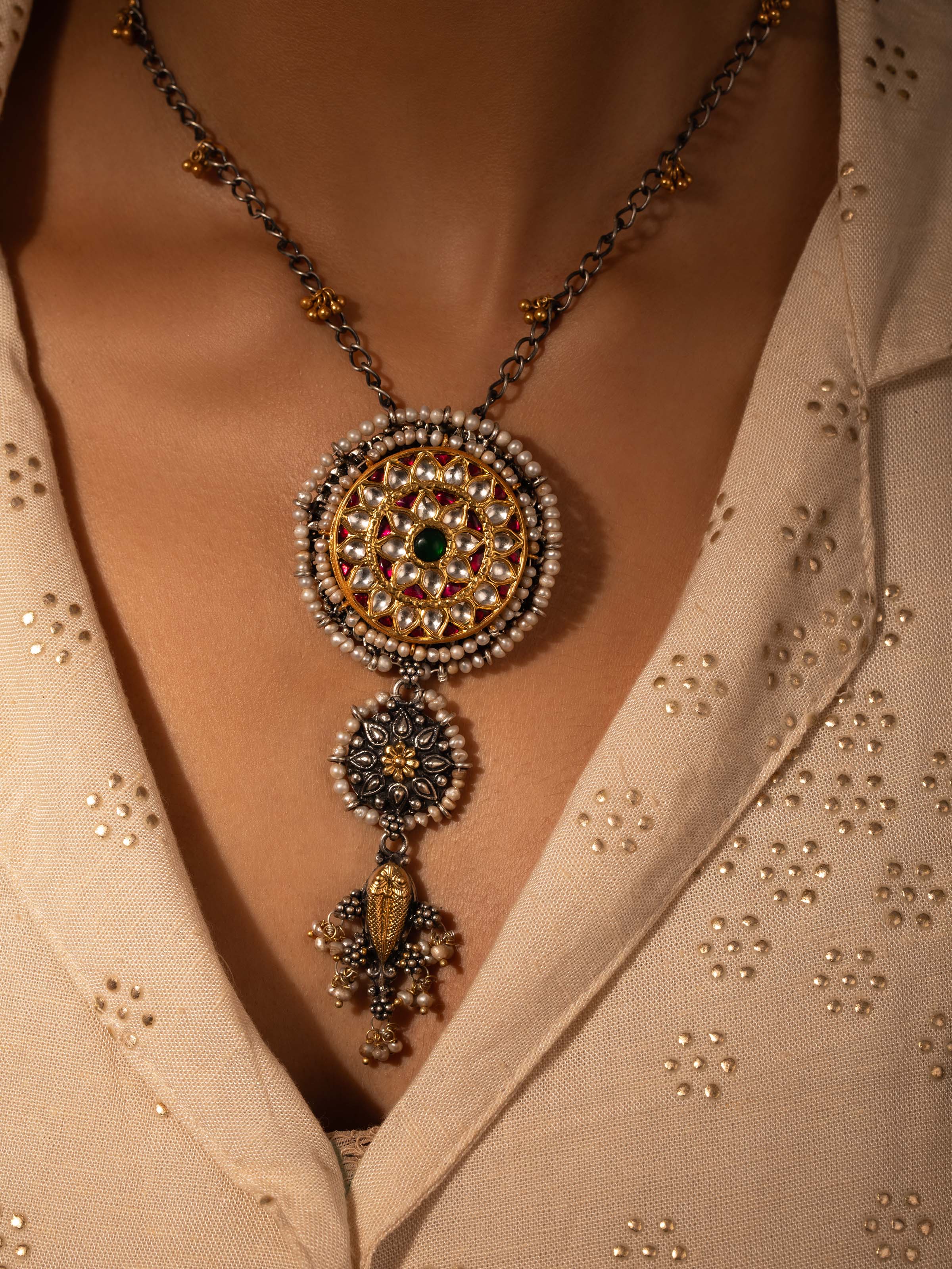 Close-up view of Silver Smithing Pendant & Chain emphasizing fine craftsmanship and silver work.